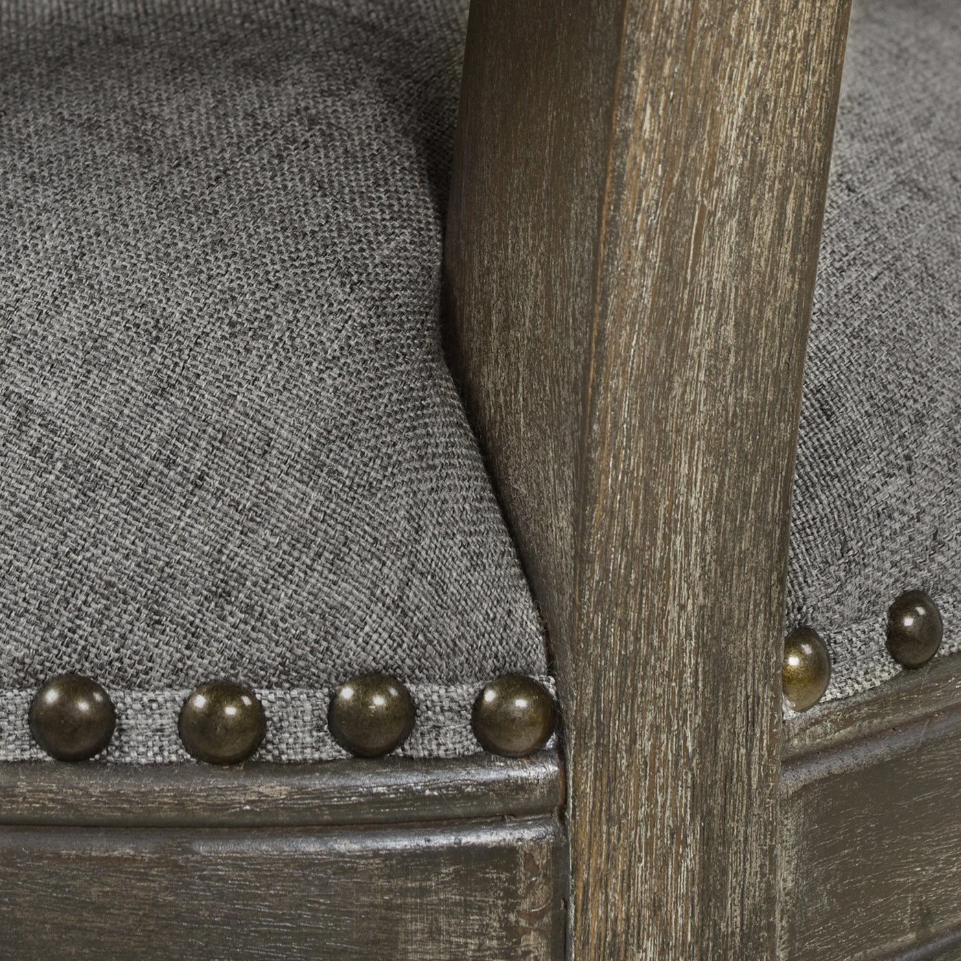Upholstered dining chair with grey fabric and rustic wood frame