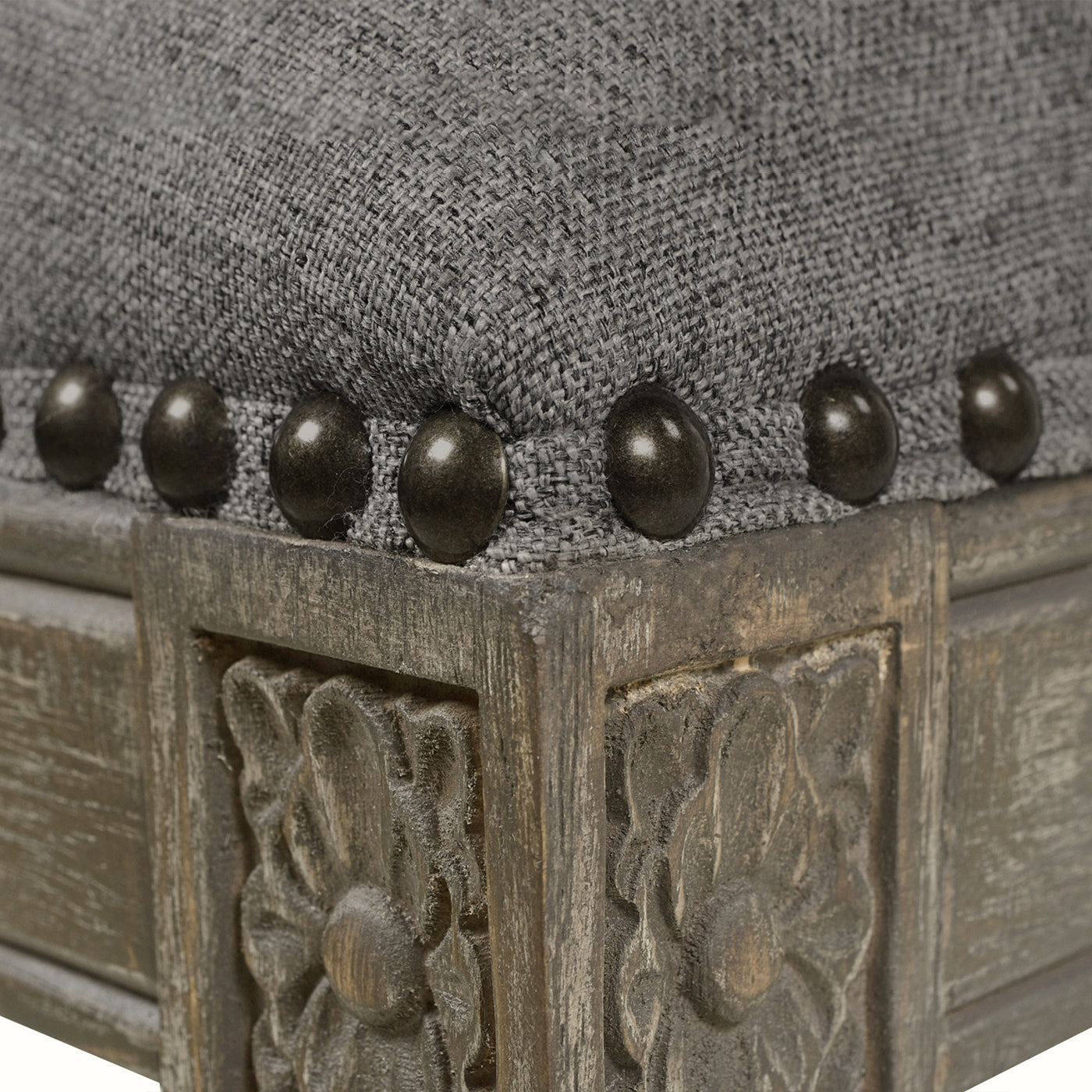 Gray linen upholstered stool with decorative nailhead trim