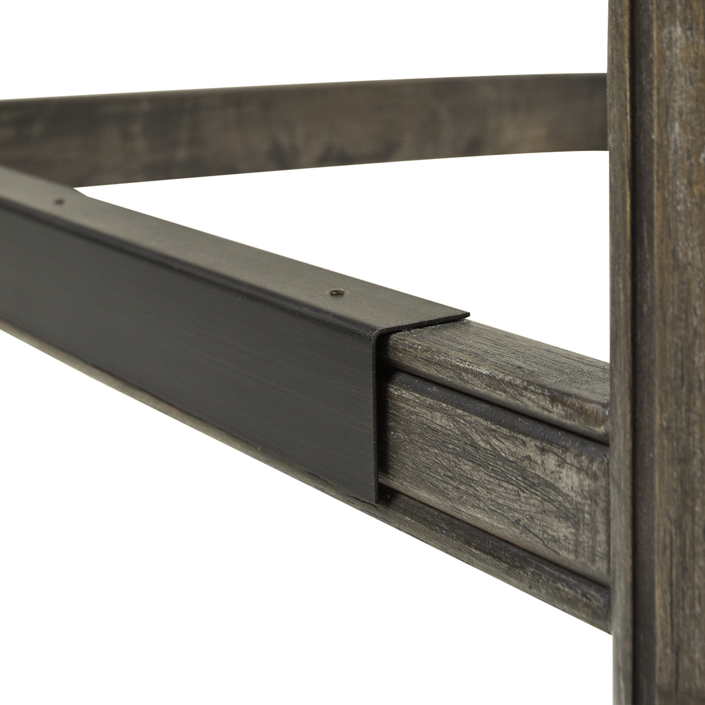 Closeup of dark metal brace on distressed wood grain table leg