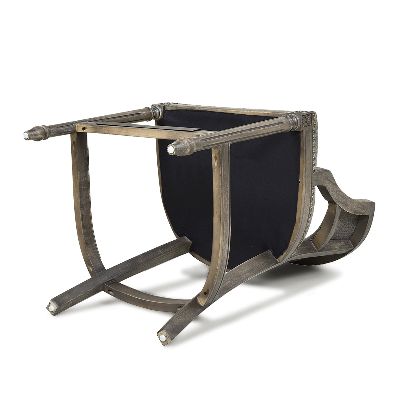 Upsidedown view of a dark wood accent chair with carved details and black upholstery