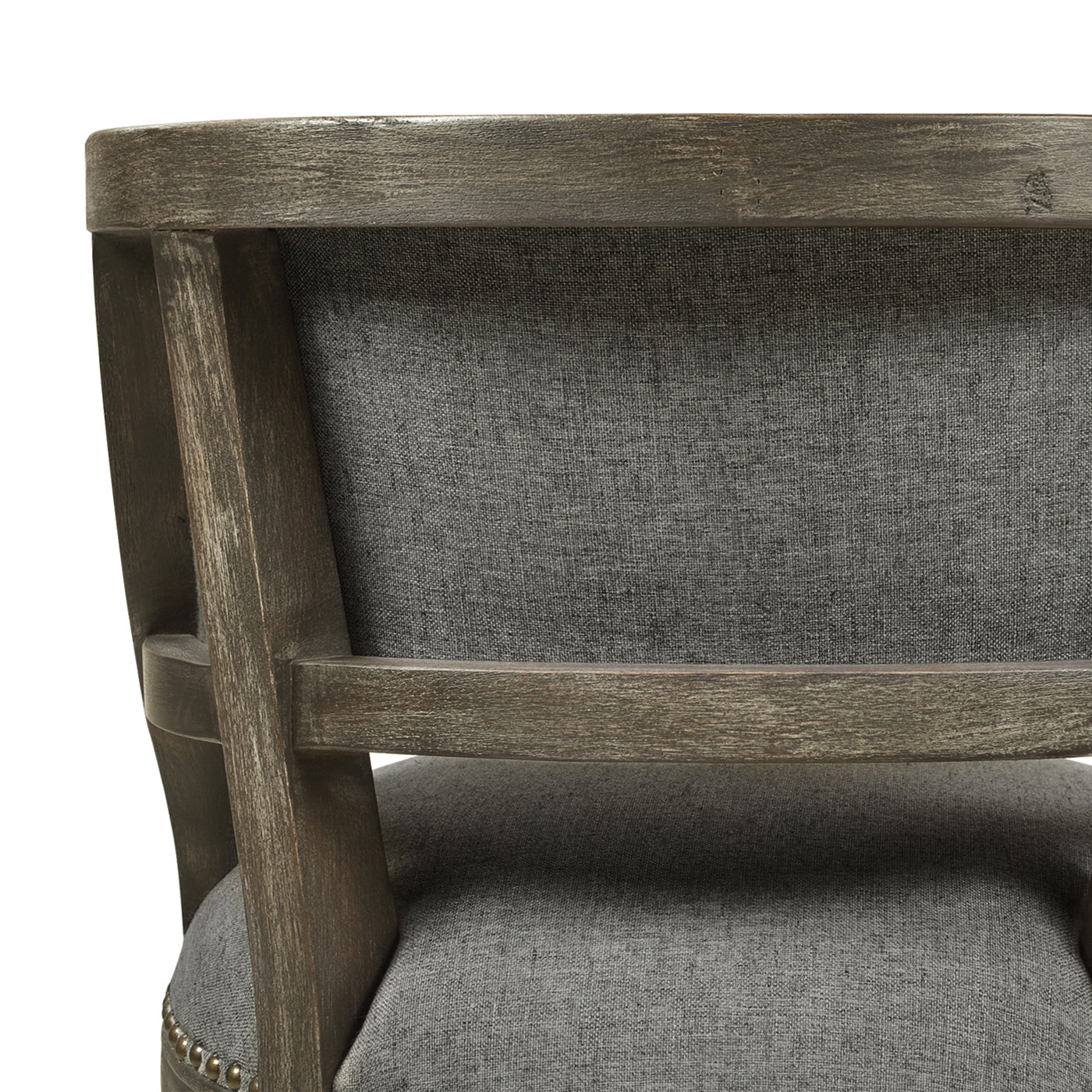 Closeup of a rustic distressed wood armchair back with grey linen upholstery