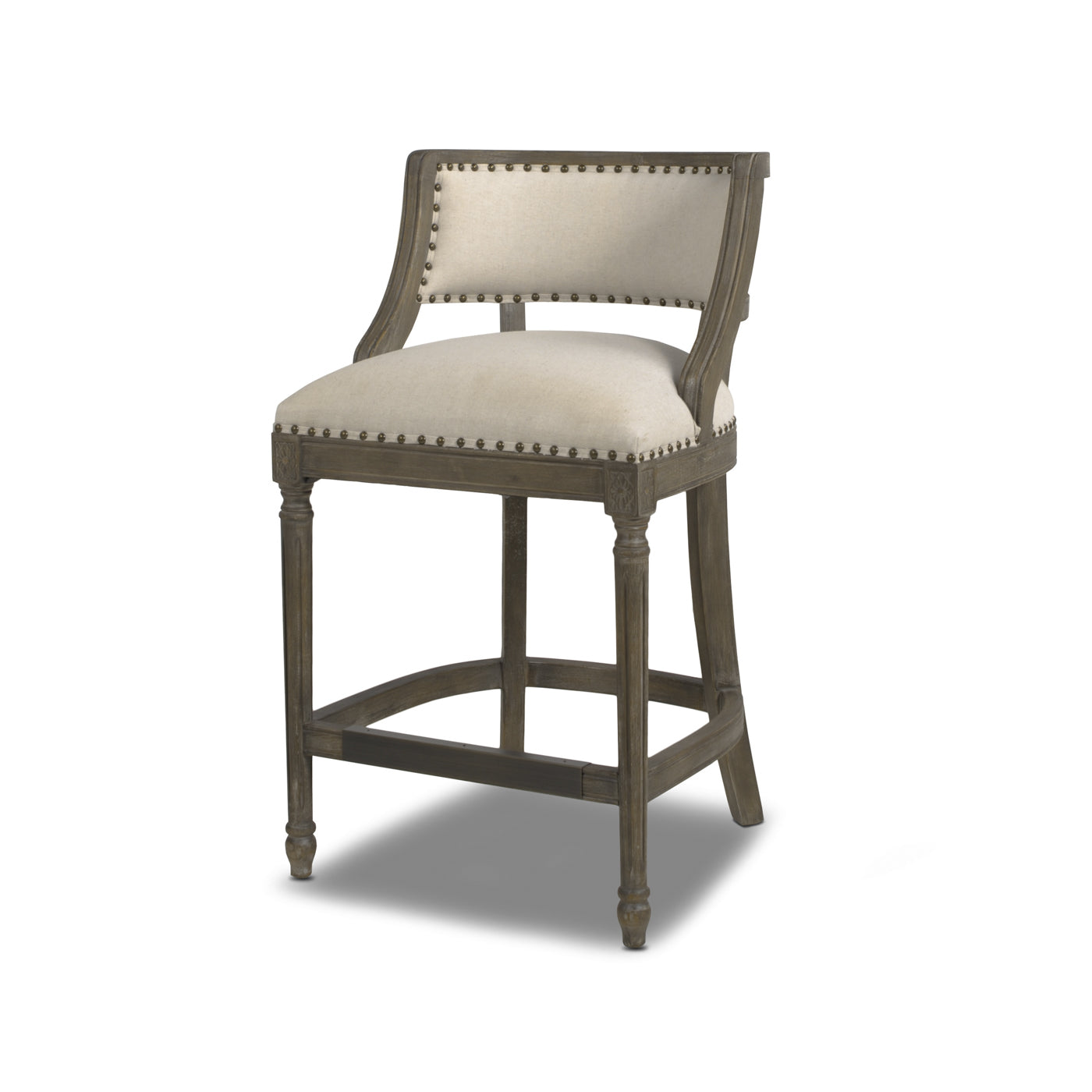 Tufted linen counter stool with carved wood frame and nailhead trim