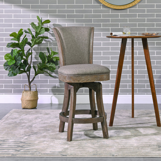 Gray upholstered swivel bar stool with distressed wood base on a modern rug