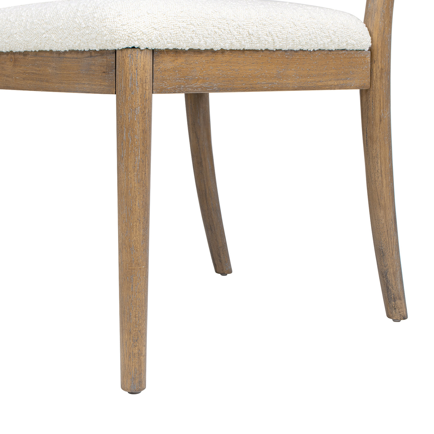 Weathered oak dining chair legs with white boucle upholstered seat detail