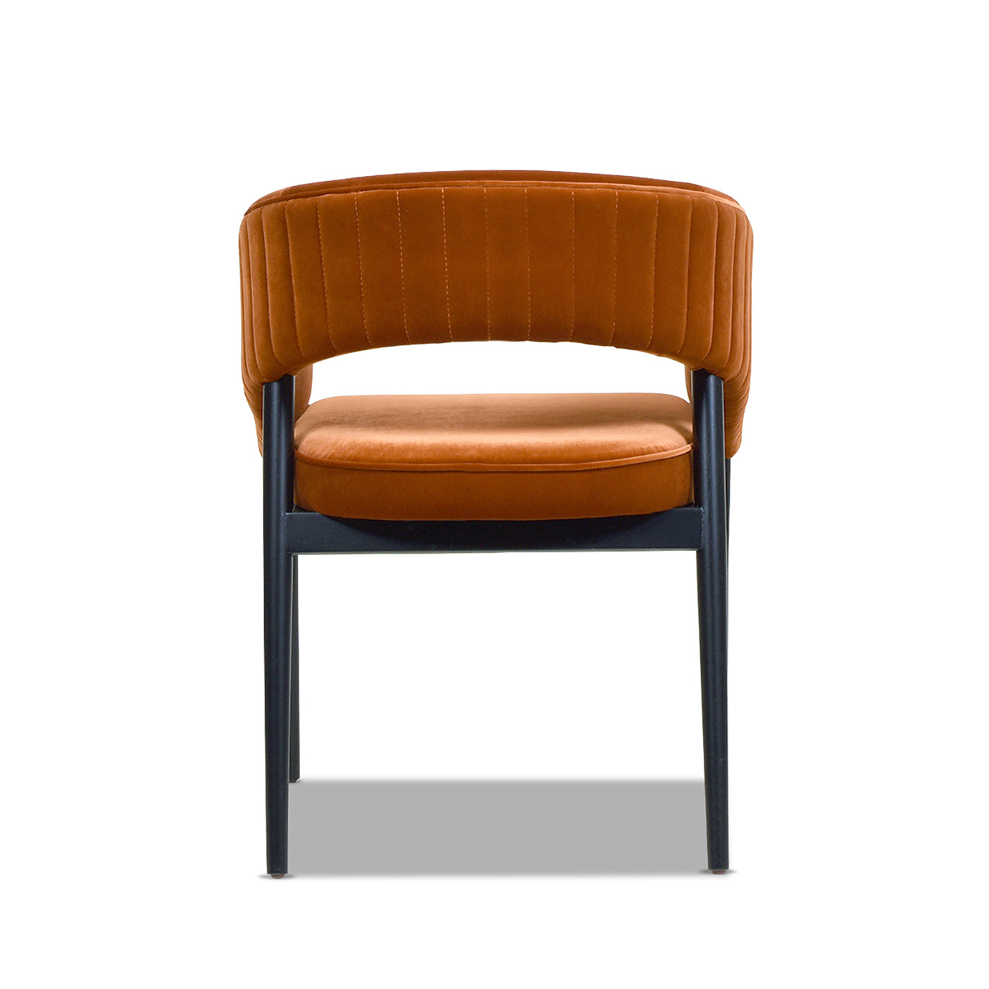 Orange velvet accent chair with channel tufting and black metal legs