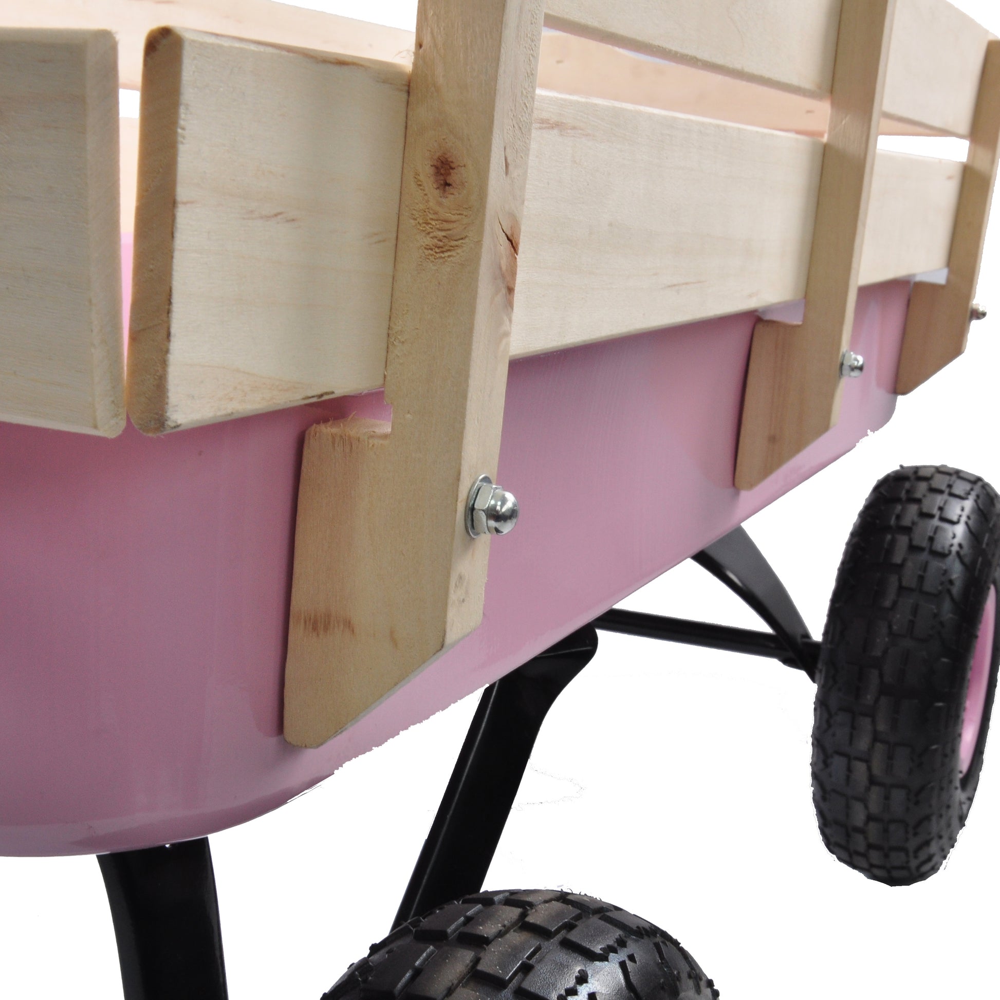 Pink garden wagon with wooden sides and pneumatic tires ideal for hauling soil