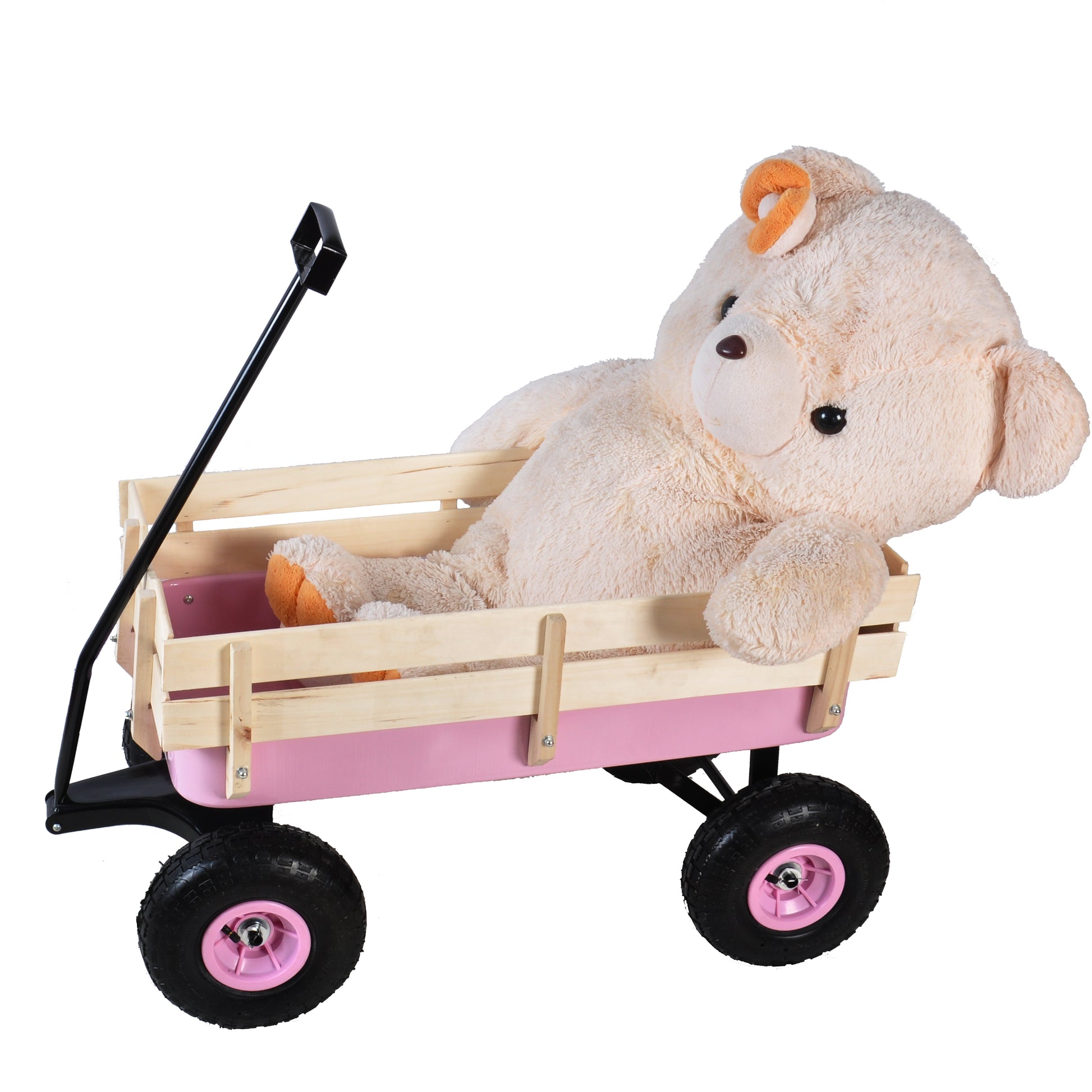 Giant plush teddy bear with orange ears in a pink and wood toy wagon