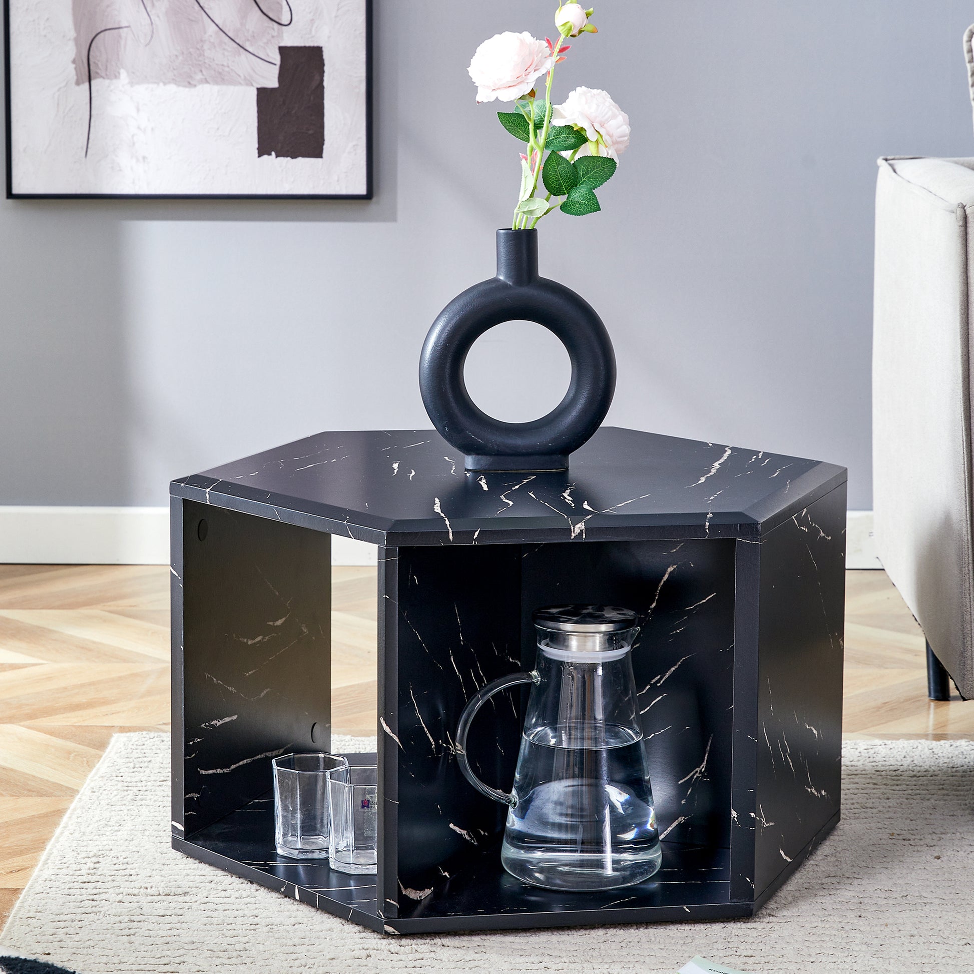 Hexagonal black marble coffee table with modern art vase and pitcher