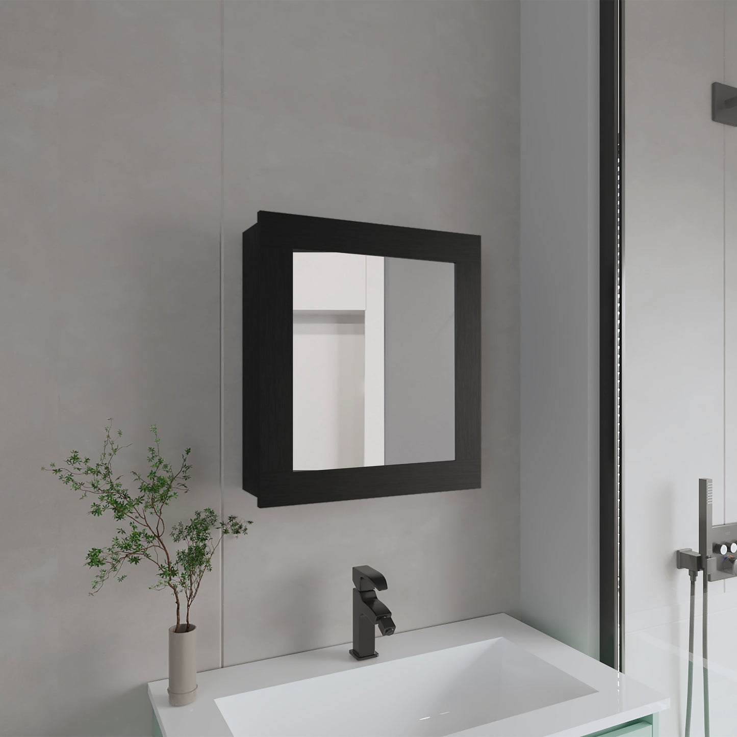Black framed bathroom medicine cabinet mounted above a white sink with a matte black faucet