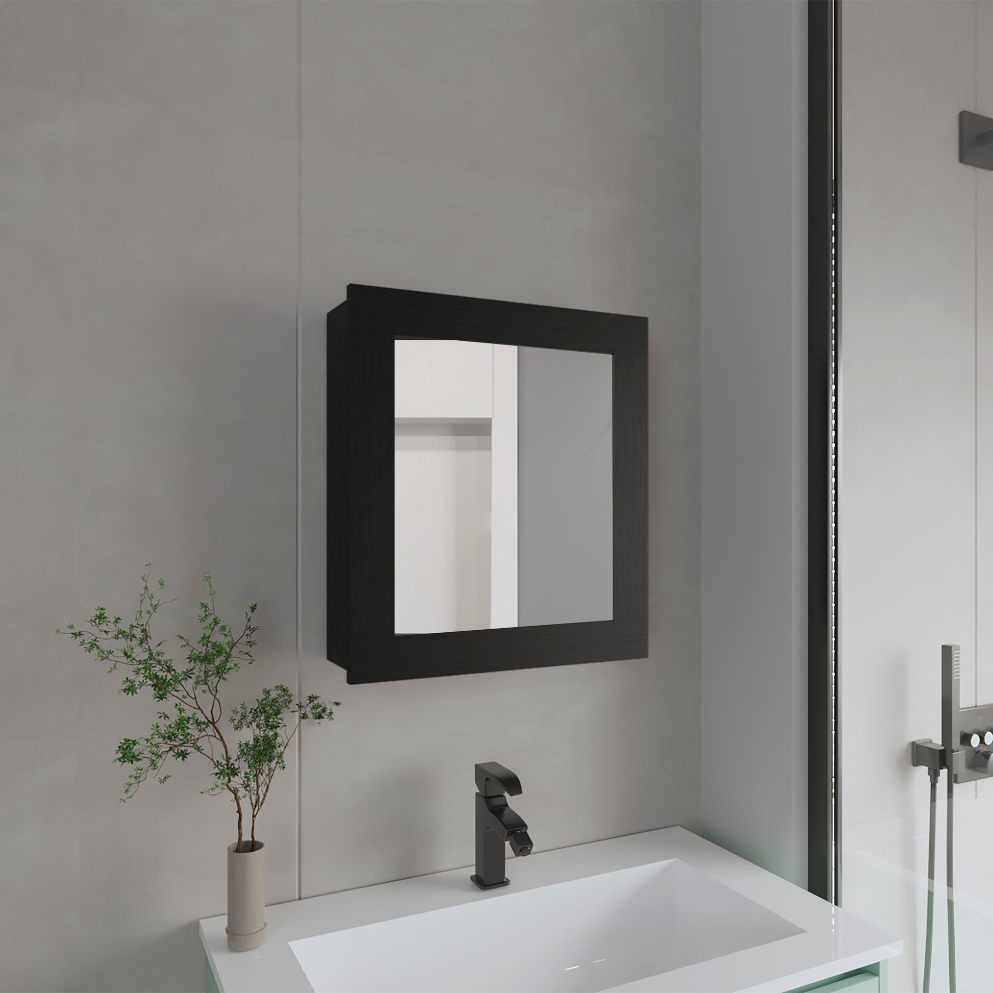 Black framed bathroom medicine cabinet mounted above a white sink with a matte black faucet
