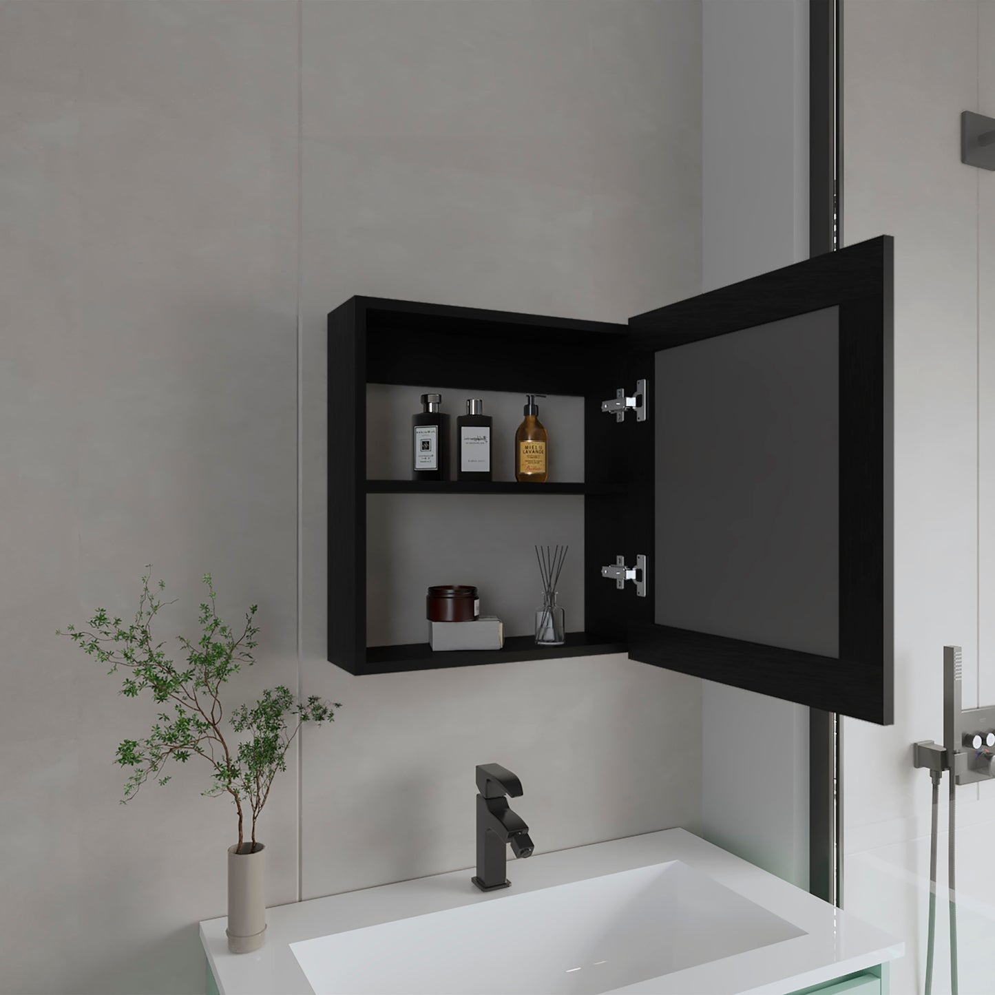 Black medicine cabinet with mirrored door storing bathroom toiletries and decorative items