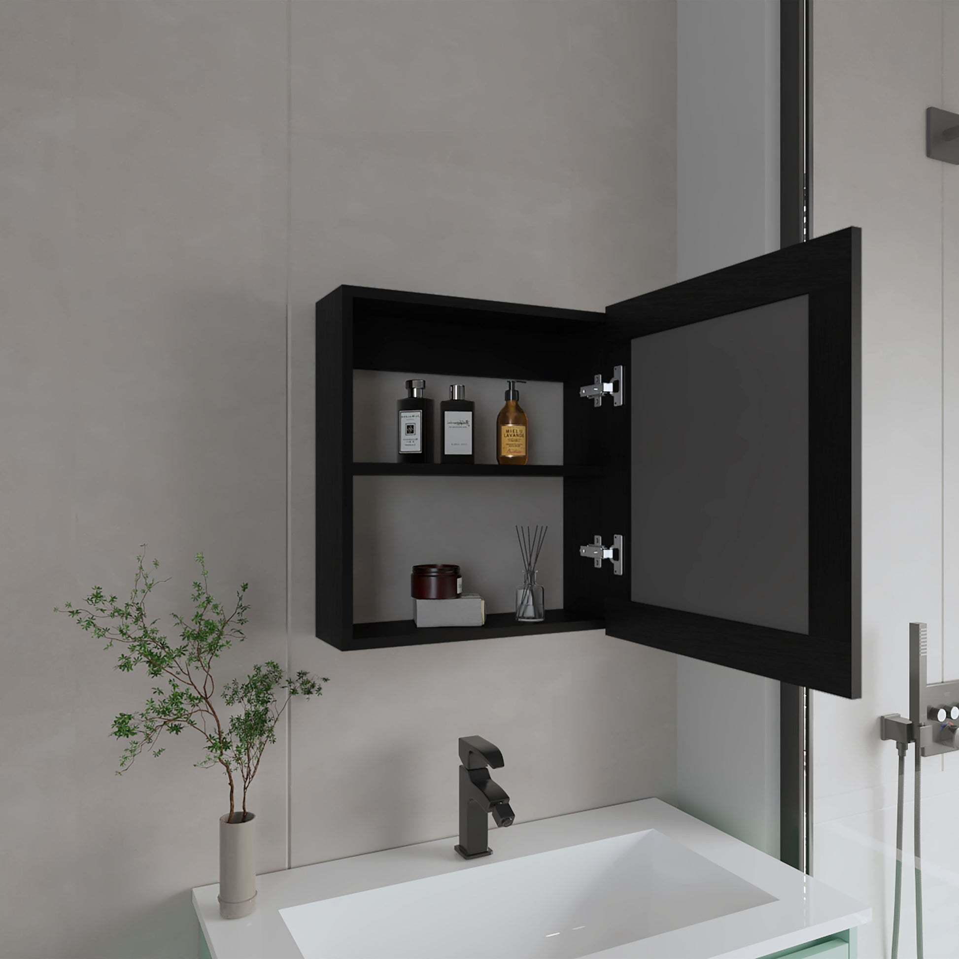 Black medicine cabinet with mirrored door storing bathroom toiletries and decorative items