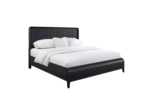 Modern black wood bed frame with slatted headboard and white bedding