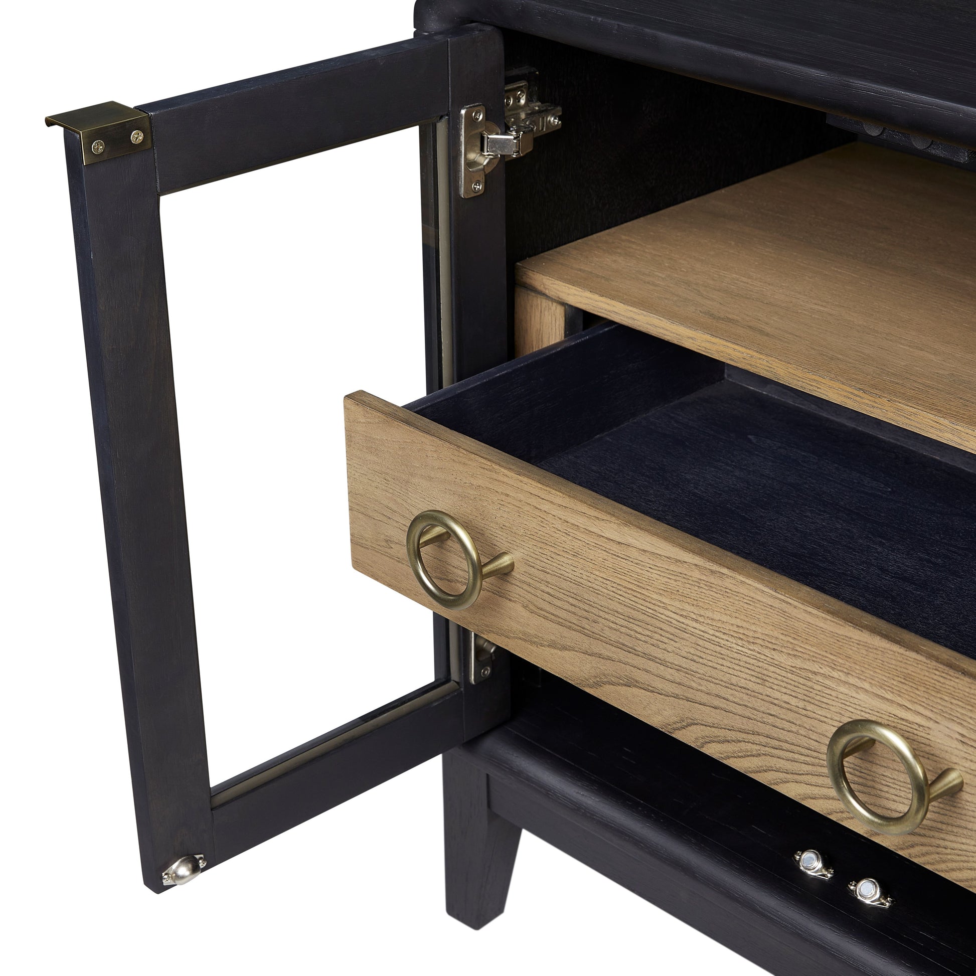 Black bedside table with brass ring pull on a natural wood drawer