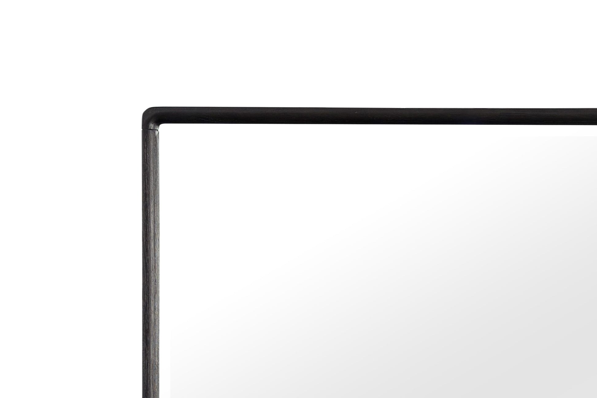 Detail of a modern dark wood framed mirror with a clean minimalist design