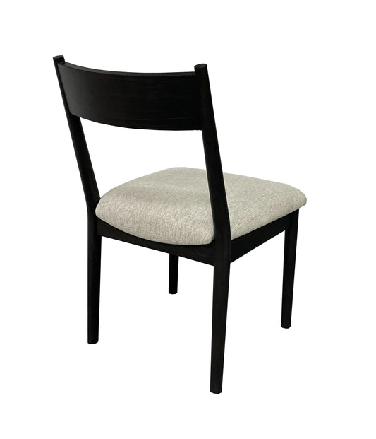 Modern black wooden chair with light gray upholstered seat angled back