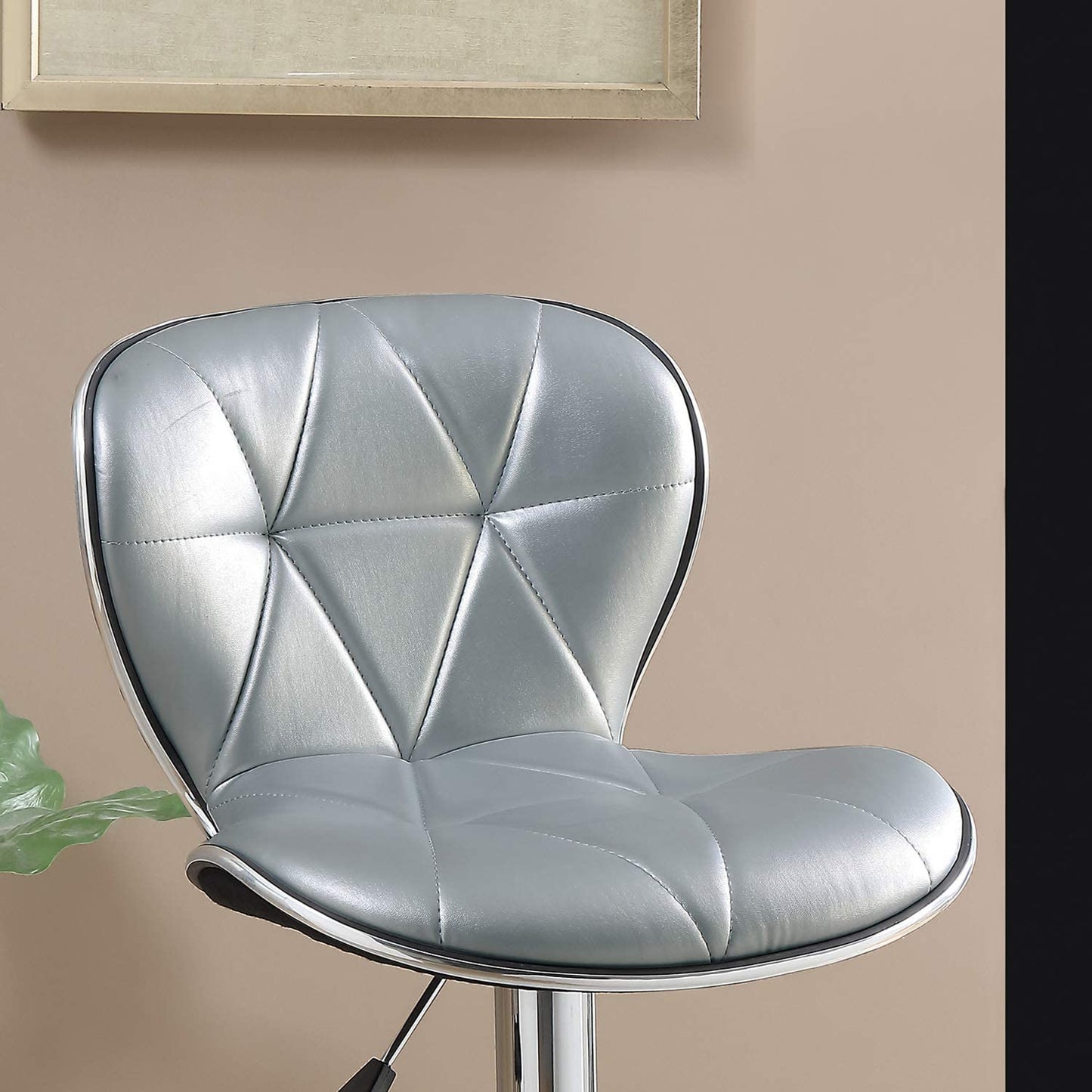 Silver tufted bar stool with chrome trim and adjustable height mechanism