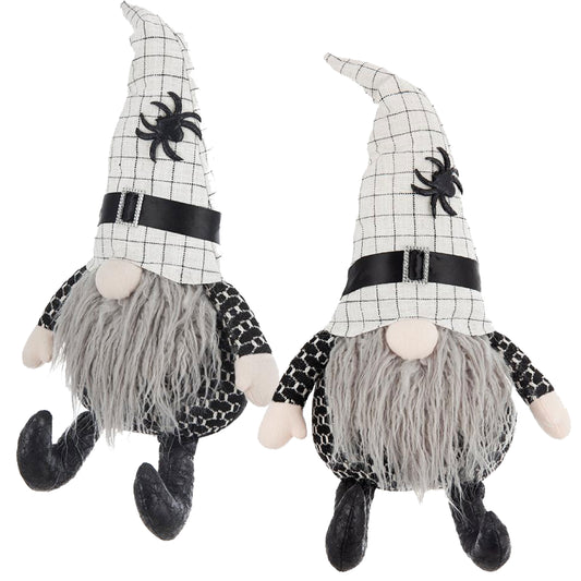Two black and white checkered Halloween gnomes with gray beards and spider decorations