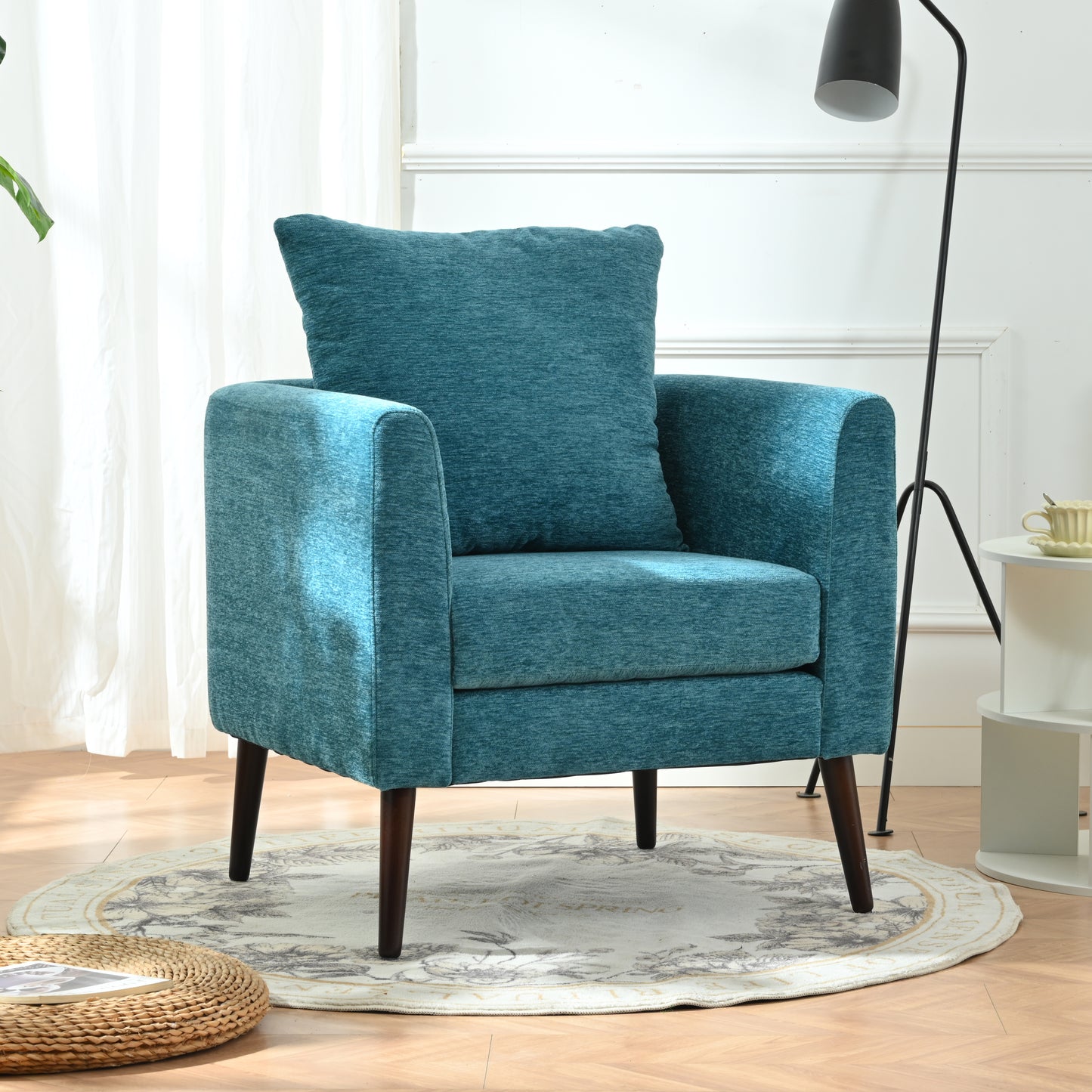 Teal textured fabric accent chair with plush cushion and dark wood legs