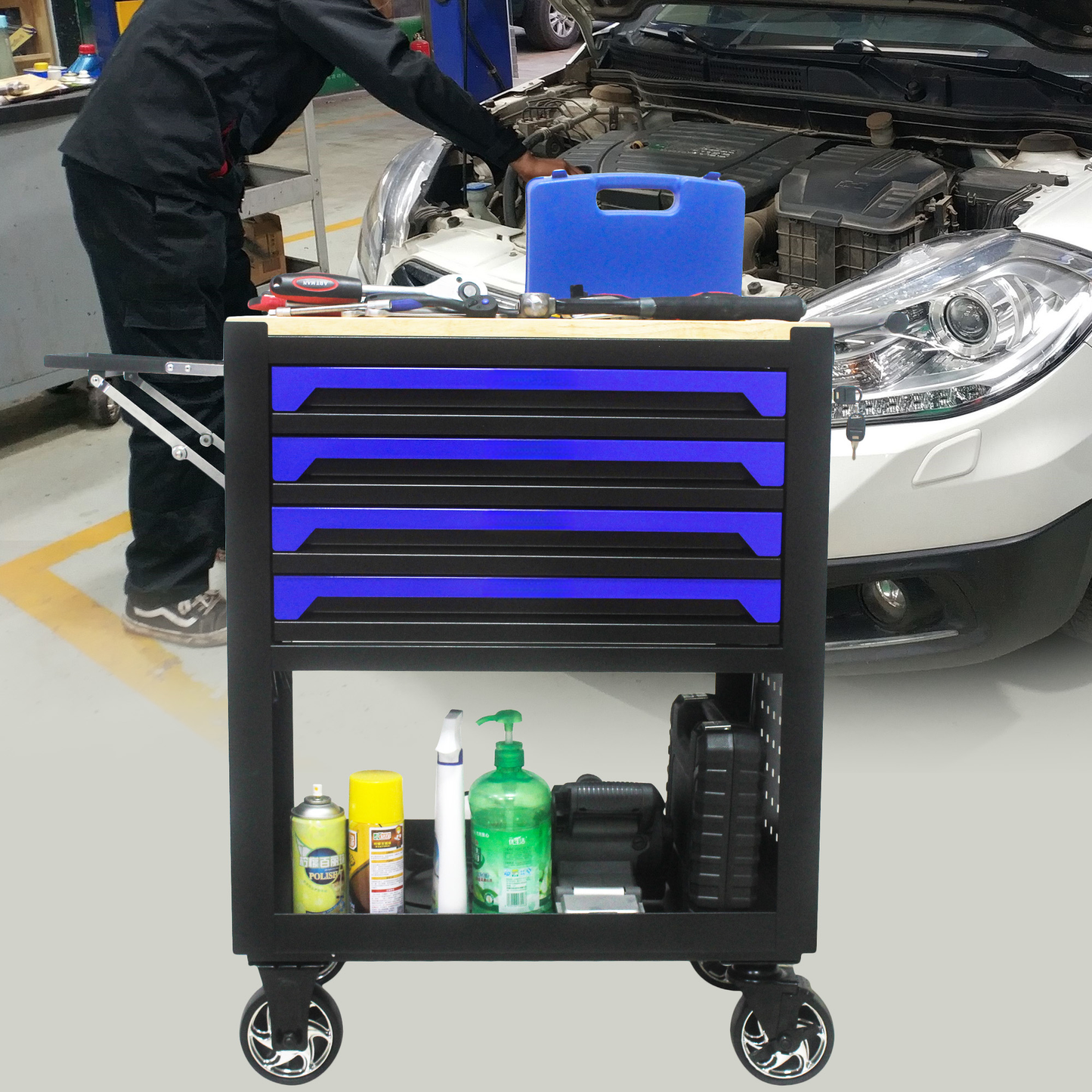 Black rolling tool chest with  drawers blue interiors ideal for auto repair