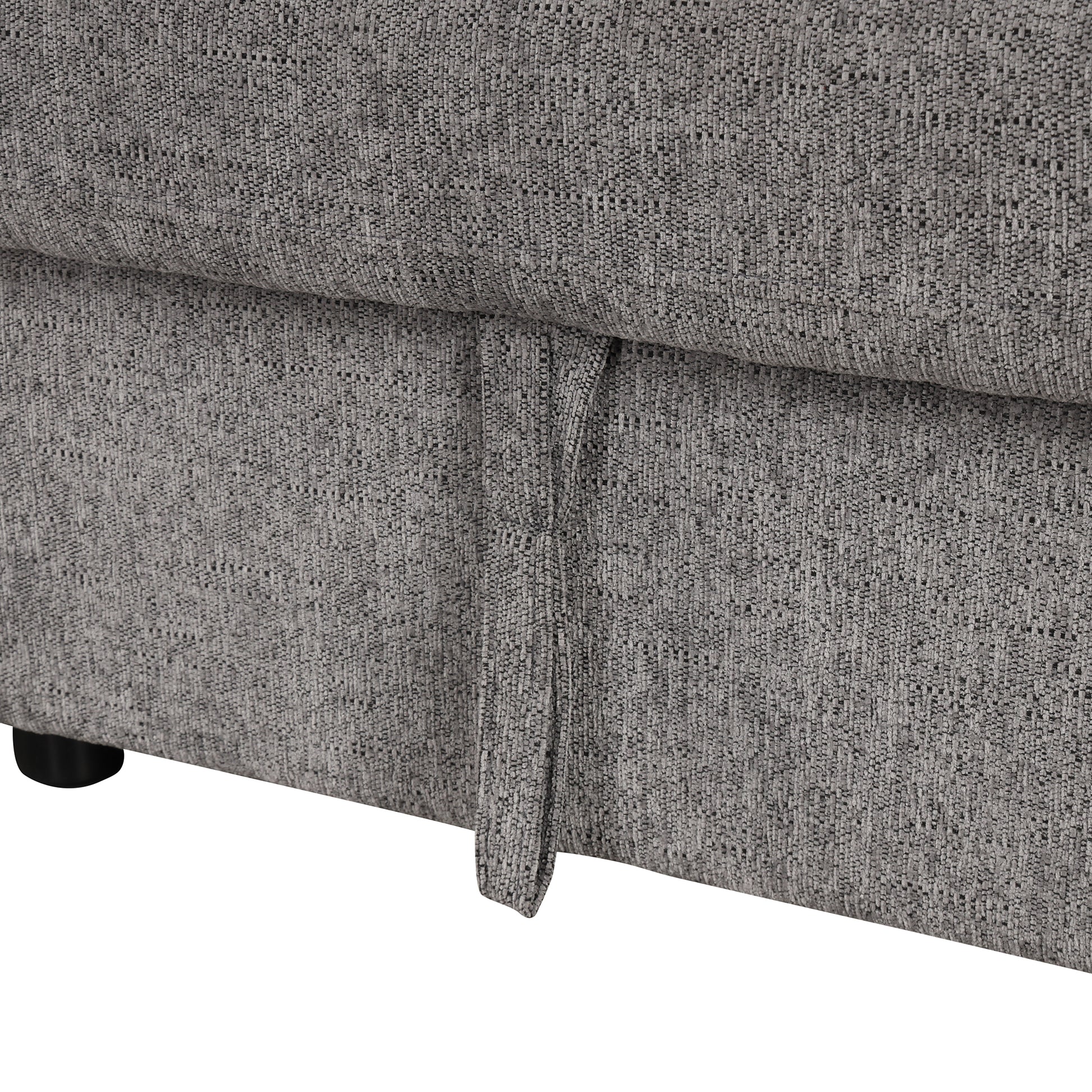Closeup of grey textured sofa fabric with a pull tab for storage Perfect for small apartment dwellers