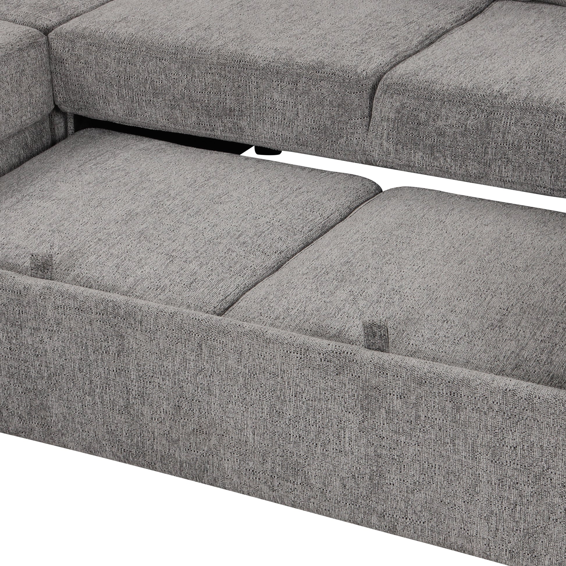 Close up of grey fabric on a sectional sofa with pullout bed mechanism
