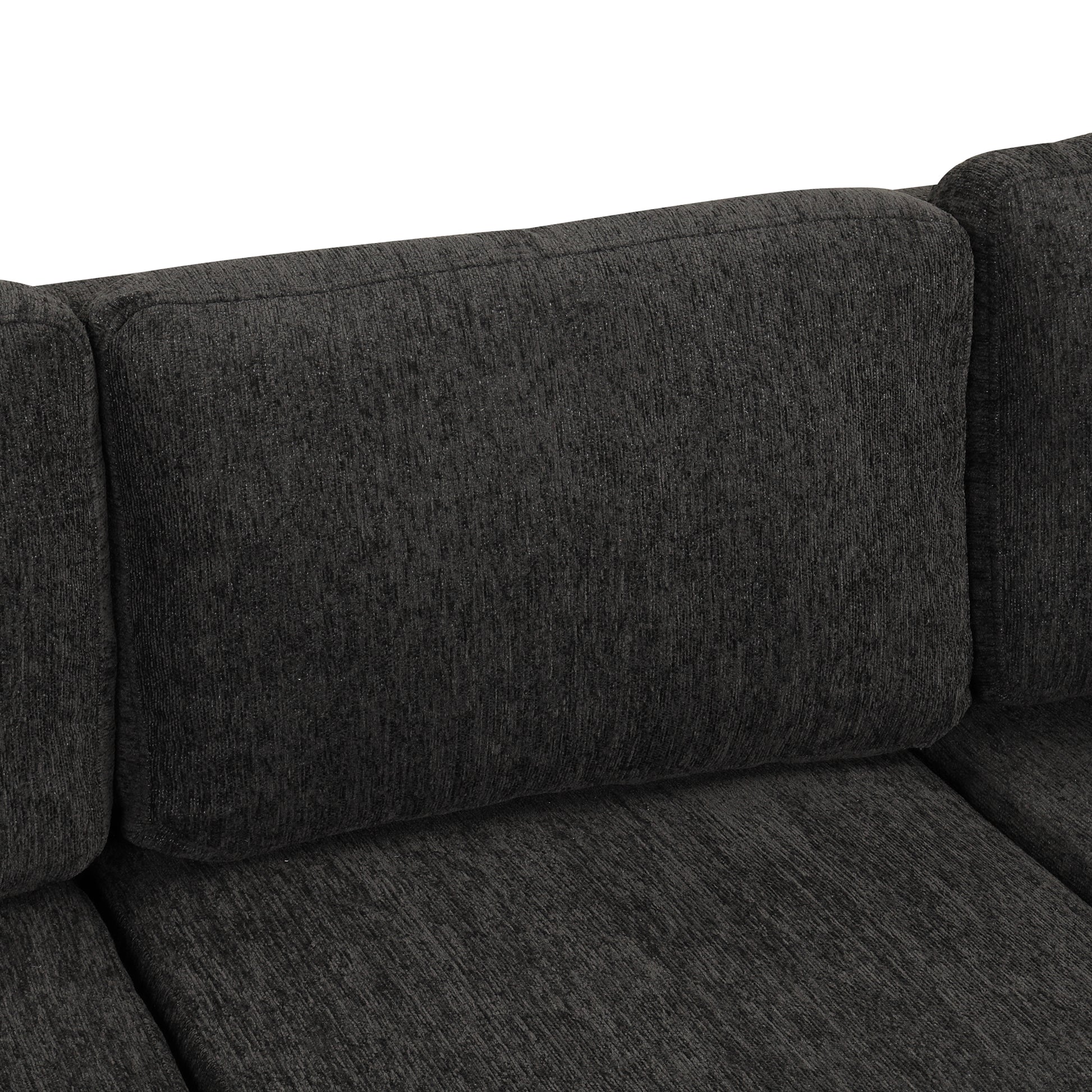 Closeup of a textured dark grey sofa cushion with a plush feel