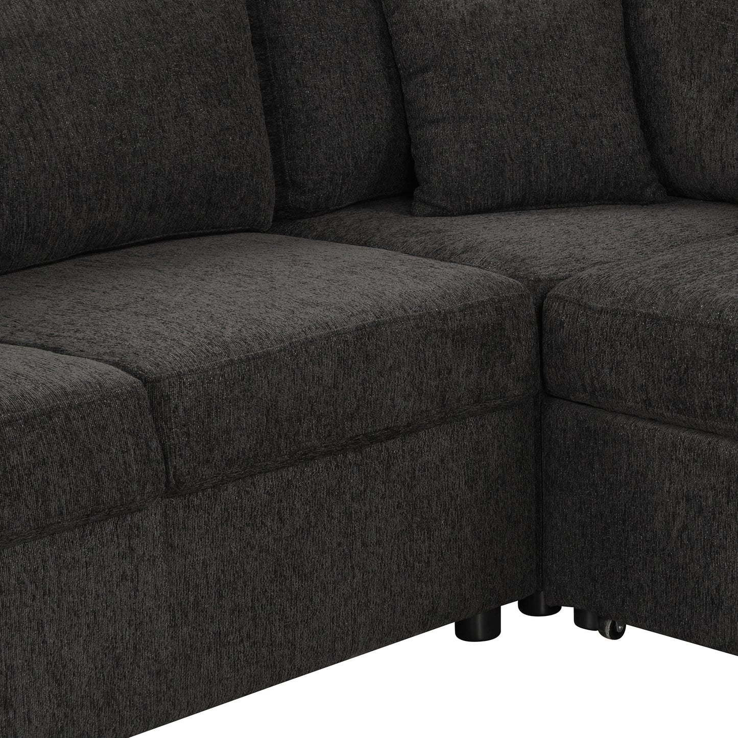 Closeup of plush charcoal grey sectional sofa upholstery with textured fabric detail