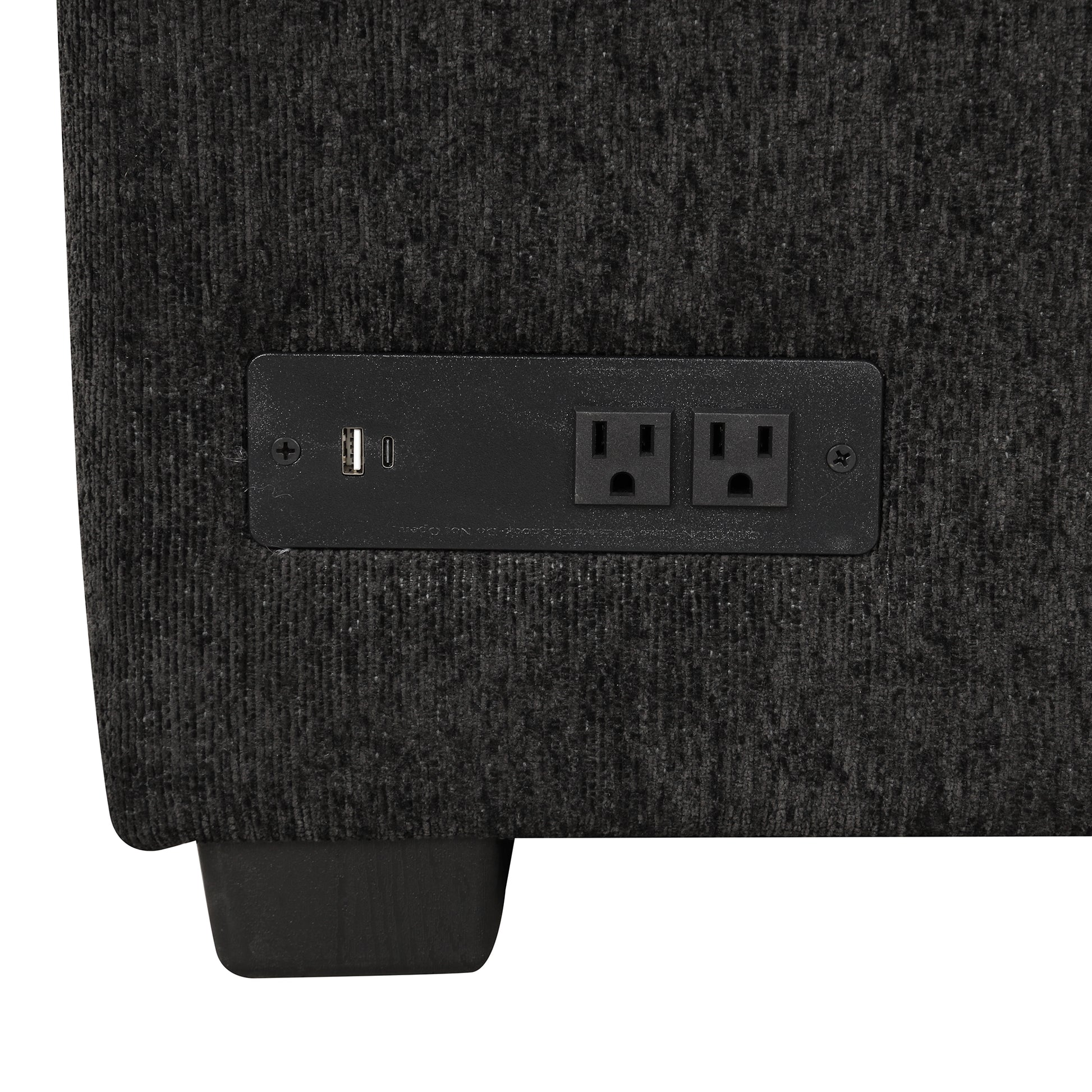 Dark gray textured fabric couch with builtin AC power outlets and USB ports