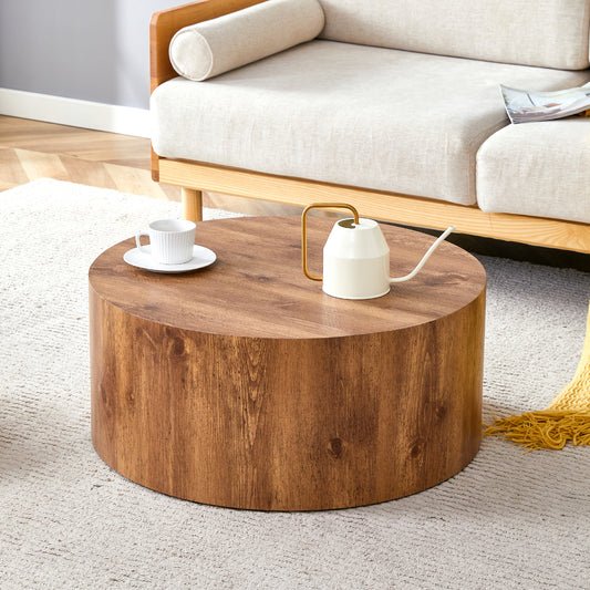 Round wood coffee table with natural grain texture and a ribbed white teacup