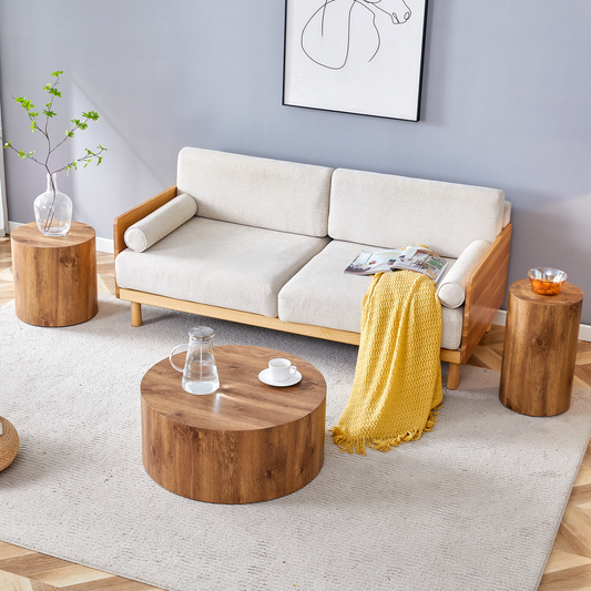 Cream fabric sofa with natural wood accents and a yellow throw