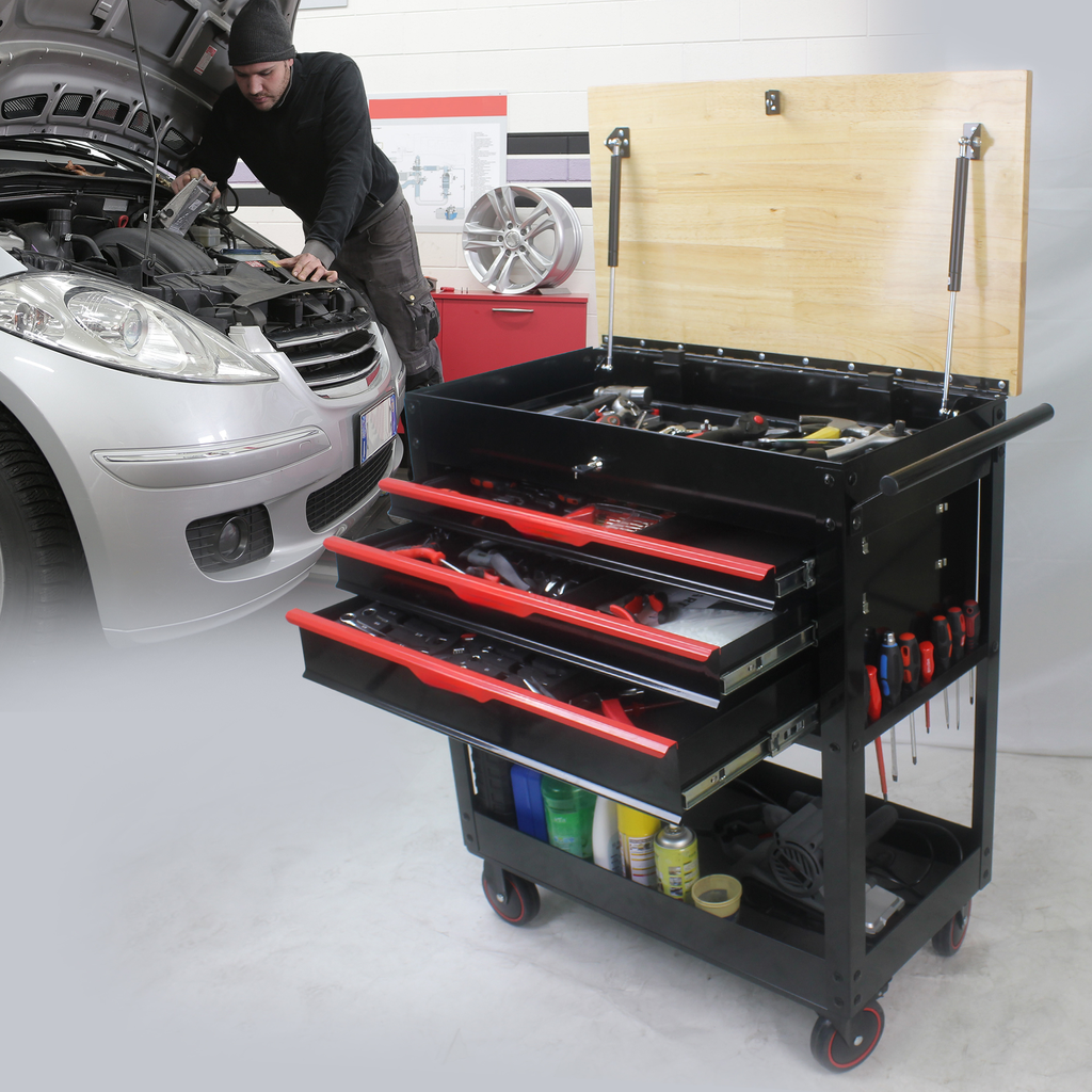 Black rolling mechanics toolbox filled with redhandled tools ideal for auto repair