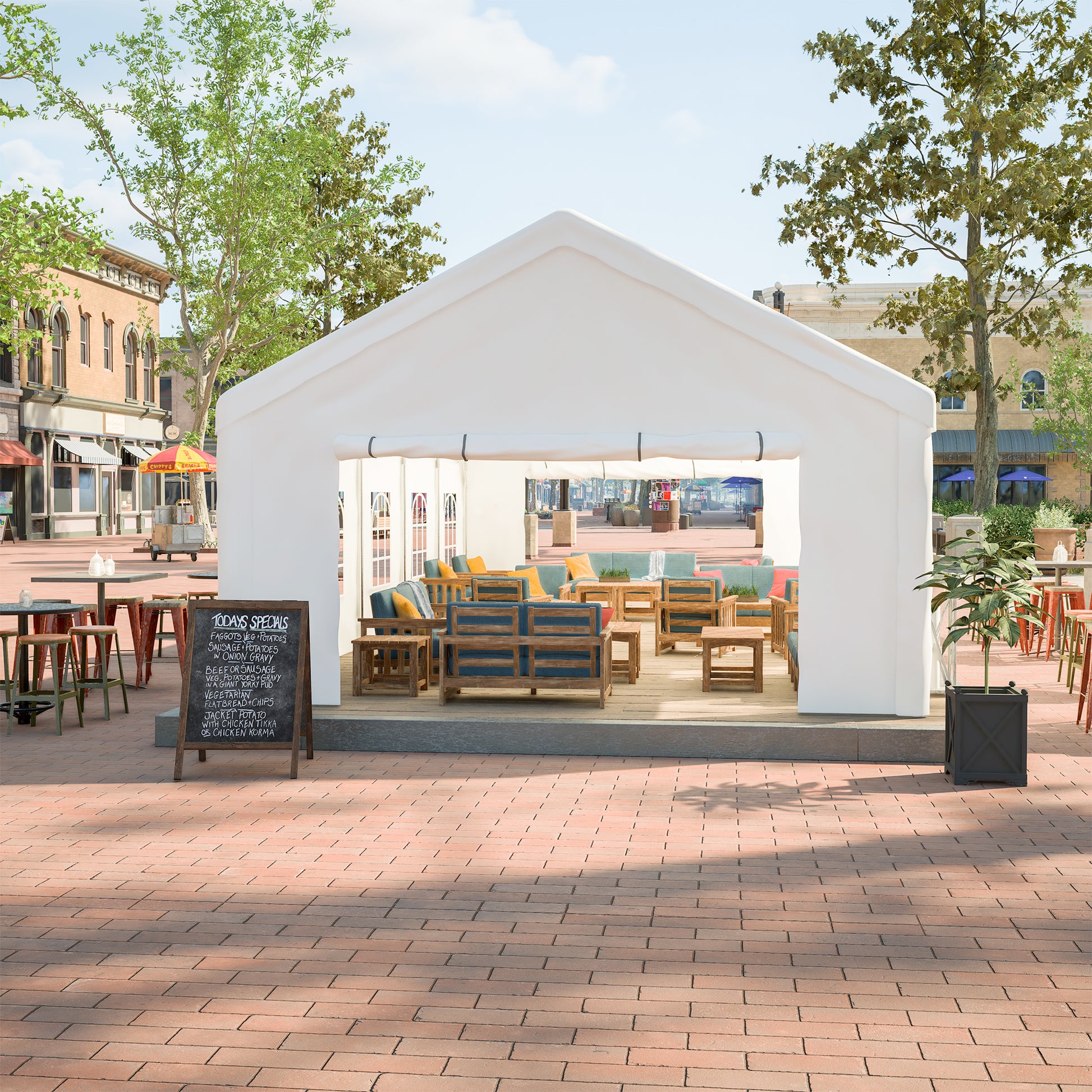Outdoor white event tent with comfortable blue upholstered seating and wooden tables