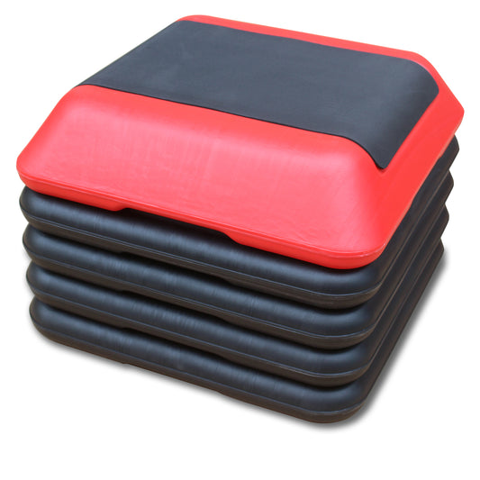 Red and black aerobic stepper stacked suitable for home fitness routines