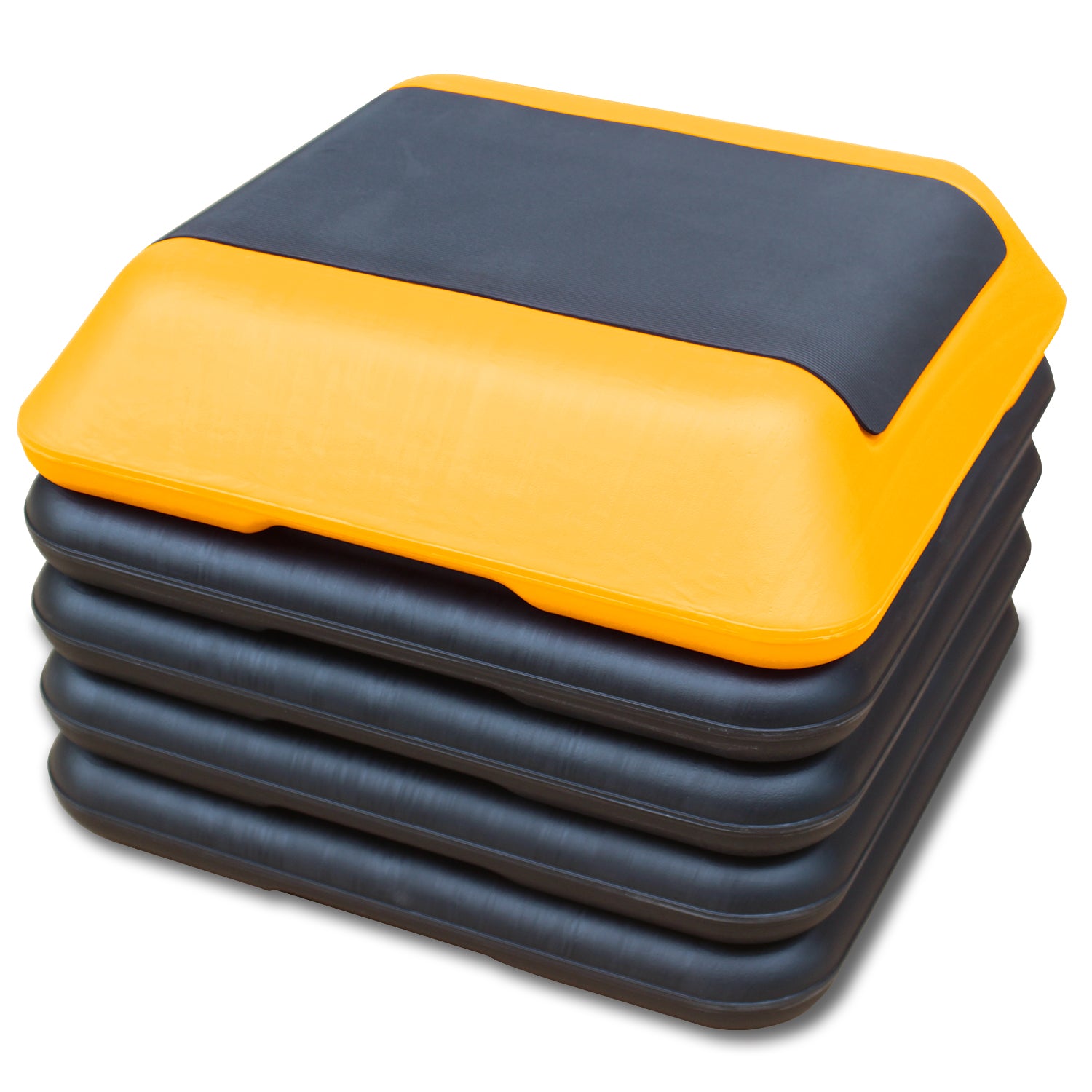 Stack of yellow and black adjustable aerobic step platforms for home workouts
