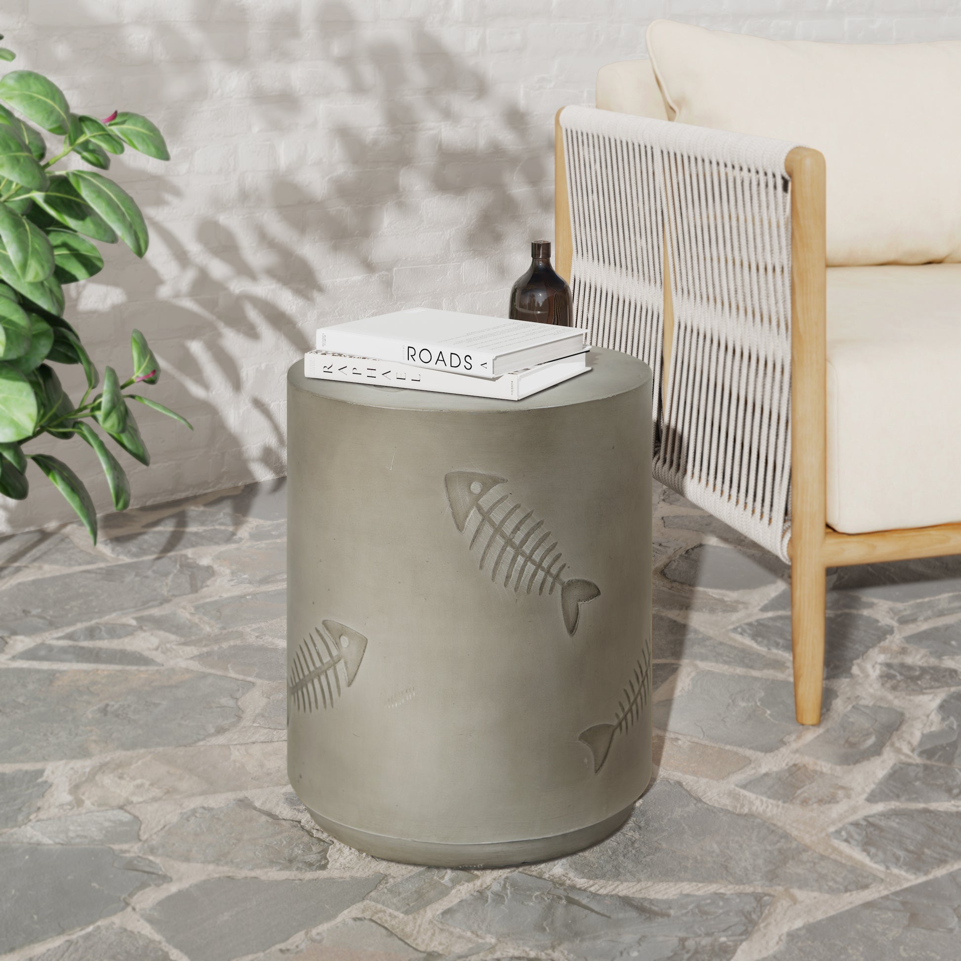 Round concrete side table with fishbone engraving perfect for patio decor