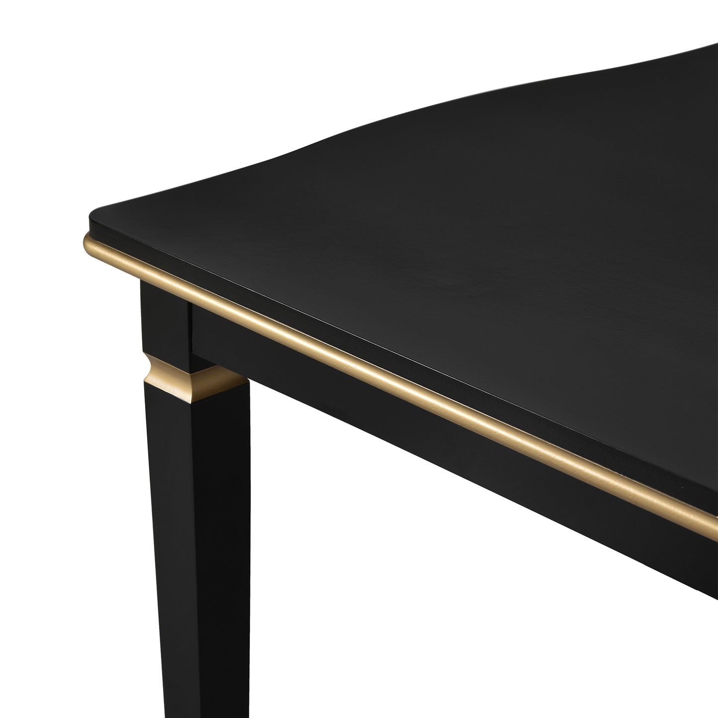 Black dining table corner with gold accent trim and tapered leg