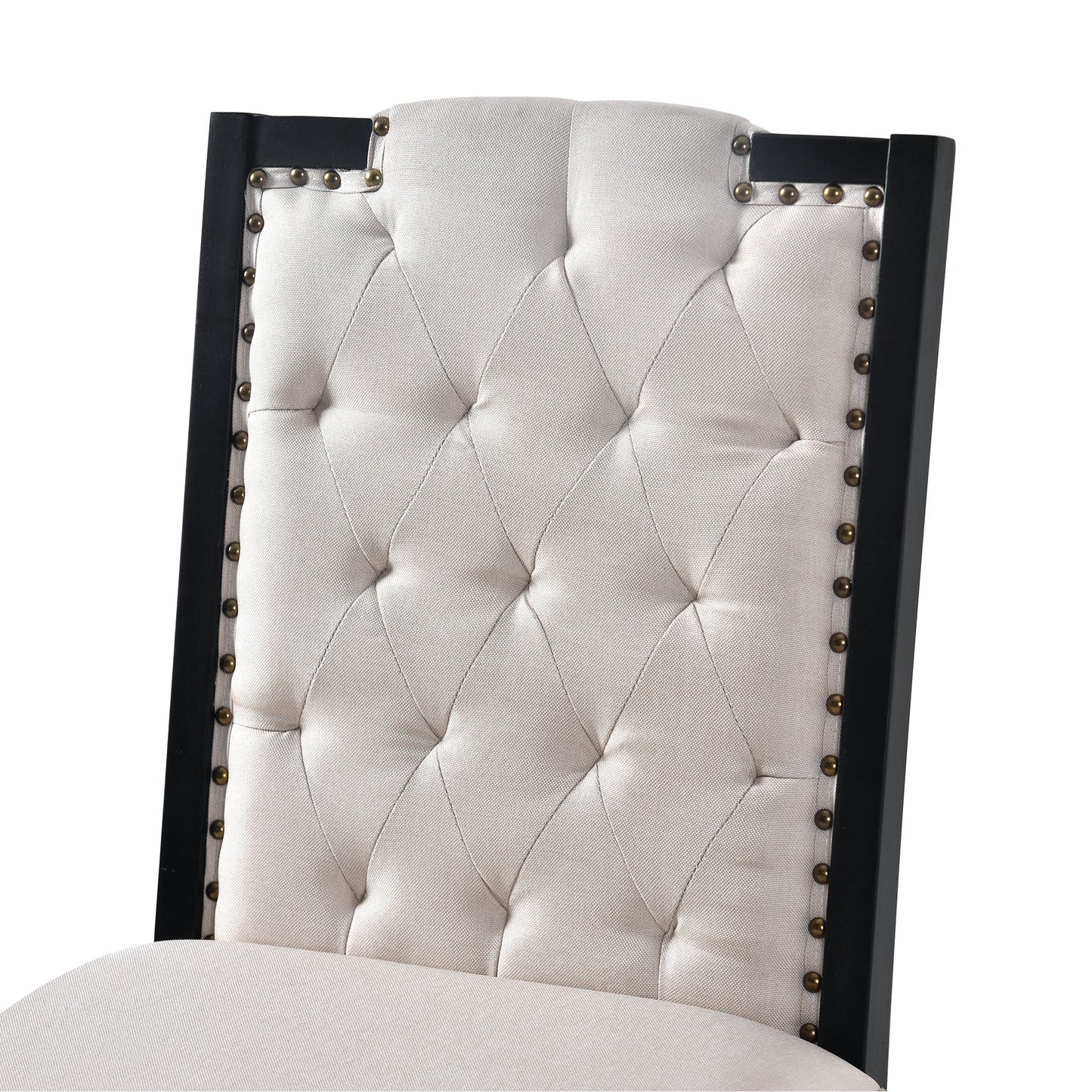 Tufted beige fabric dining chair with black wood frame and brass nailhead trim