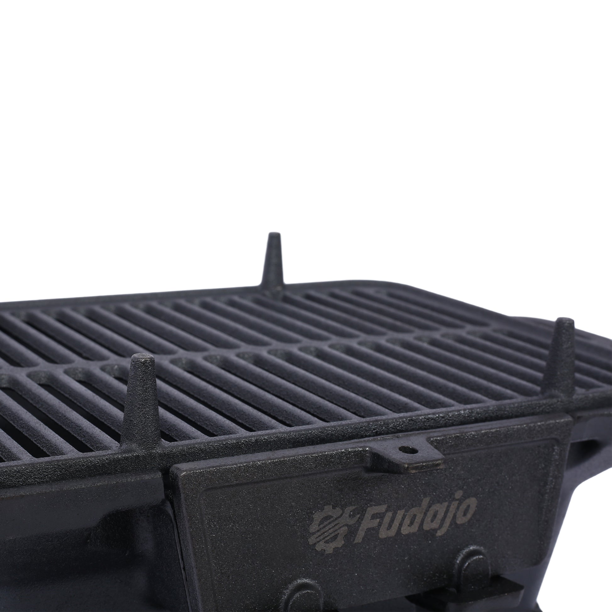 Closeup of a black cast iron grill grate with raised support posts