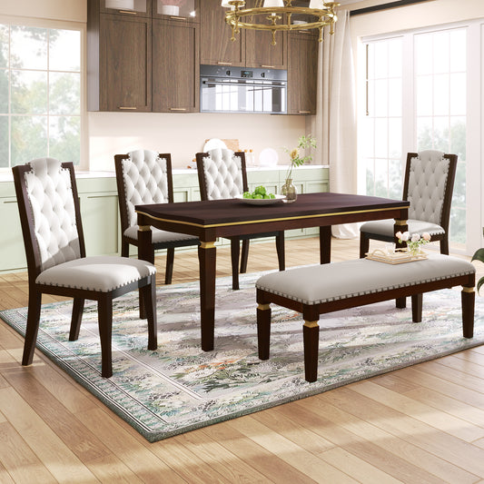 Dark wood dining table with upholstered tufted chairs and bench in a bright kitchen
