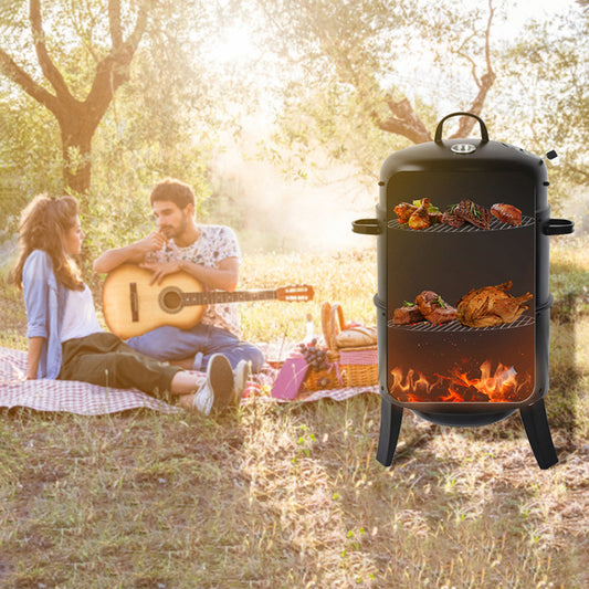 Black vertical smoker grill with ribs chicken and steaks cooking