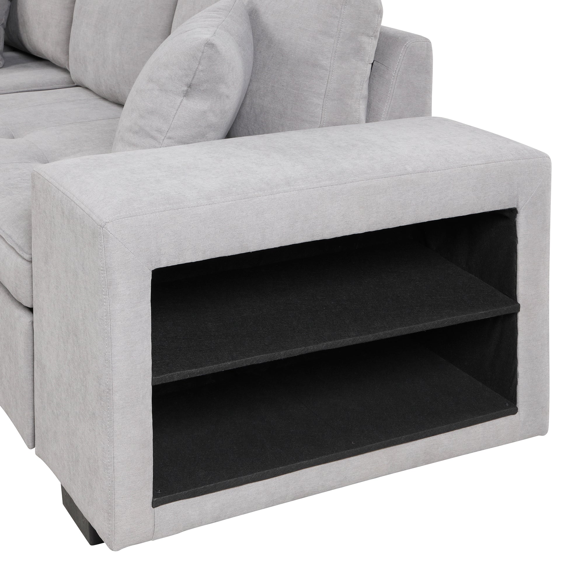 Light gray fabric sectional sofa with builtin storage shelf