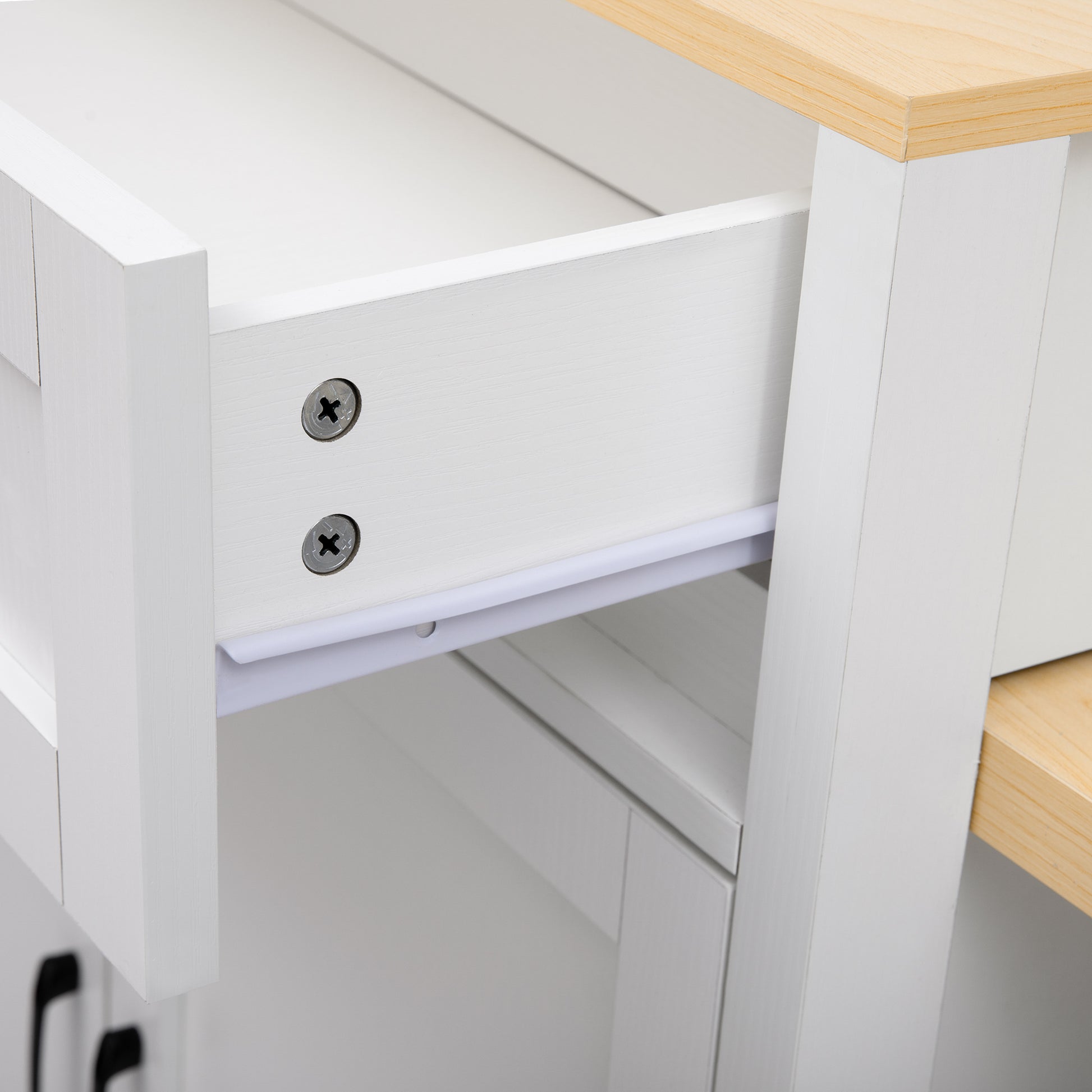 White wooden bedside table drawer with visible screws and slide mechanism