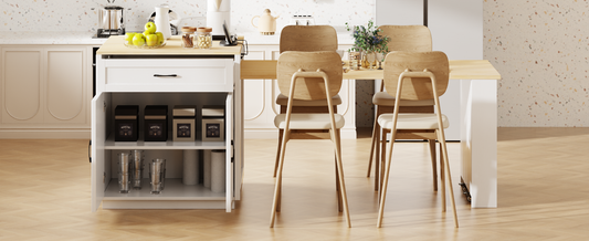 White kitchen island with open storage shelves holding coffee canisters and glasses