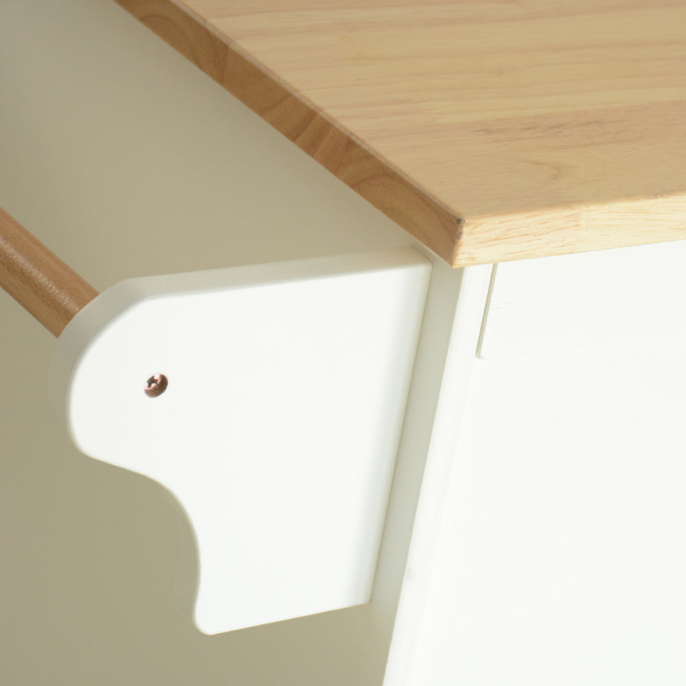 Closeup of a white wooden support bracket with a light wood tabletop