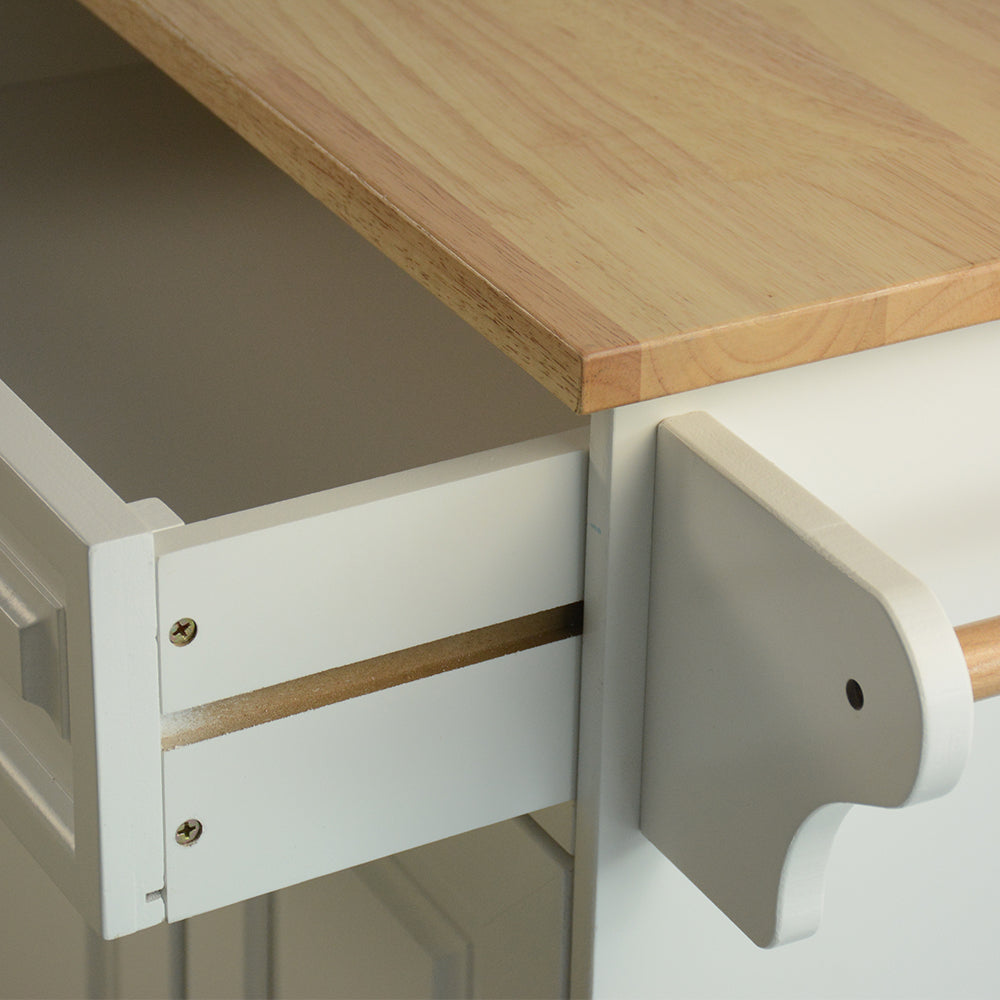 Closeup of a white drawer with natural wood top