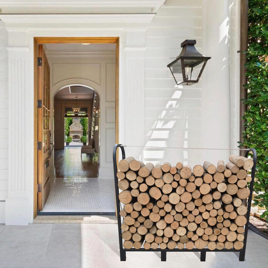 Black metal log holder filled with neatly stacked firewood by an entrance