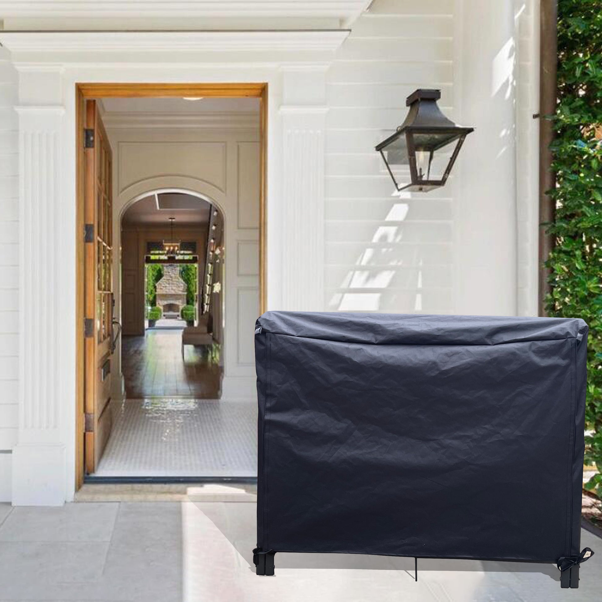 Dark gray outdoor grill cover with adjustable tiedowns for secure fit