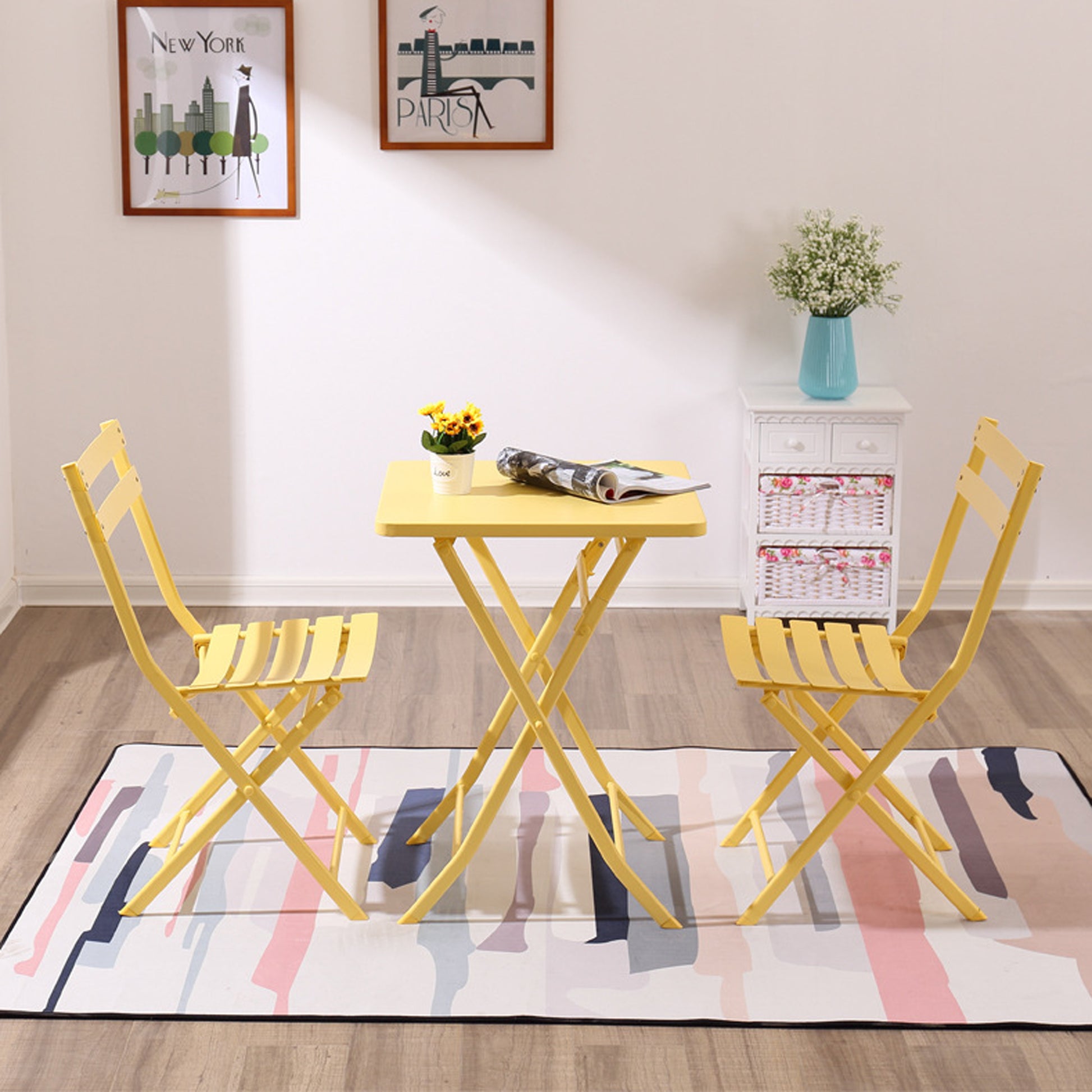 Yellow metal folding bistro set with two chairs and square table