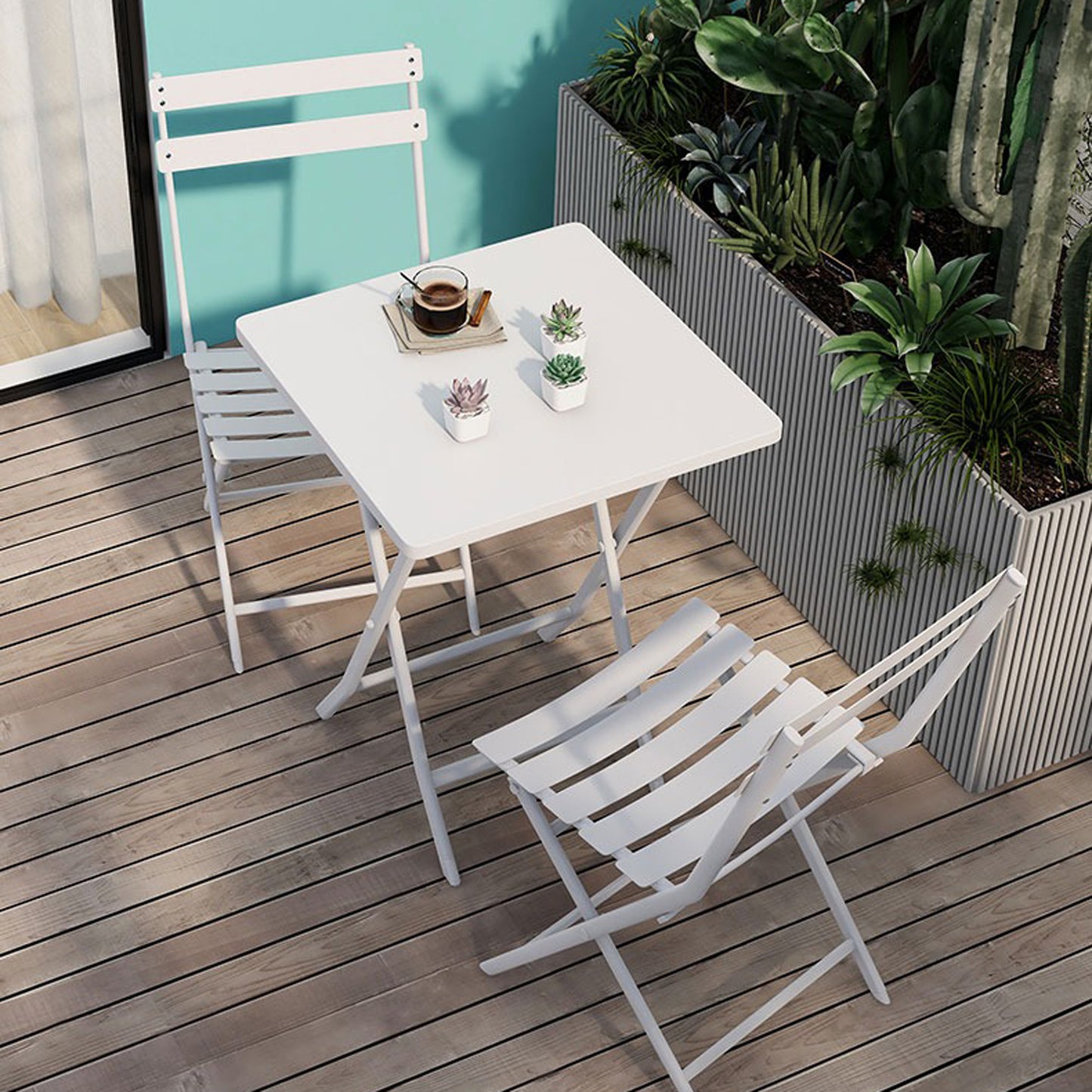 White metal folding bistro set with square table and slatted chairs on wooden deck